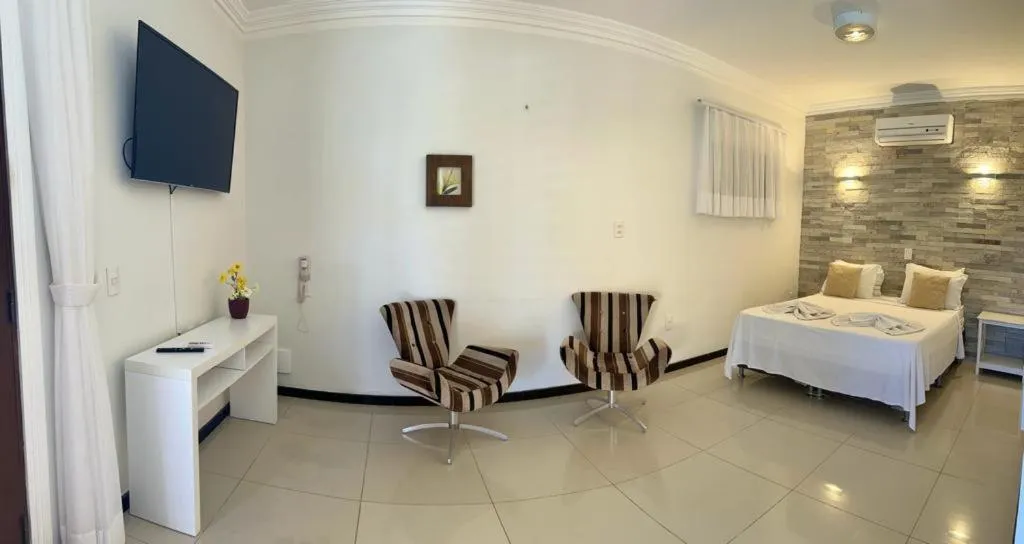 Bed in Pousada Refúgio Jardim de Canoa by Borboleta