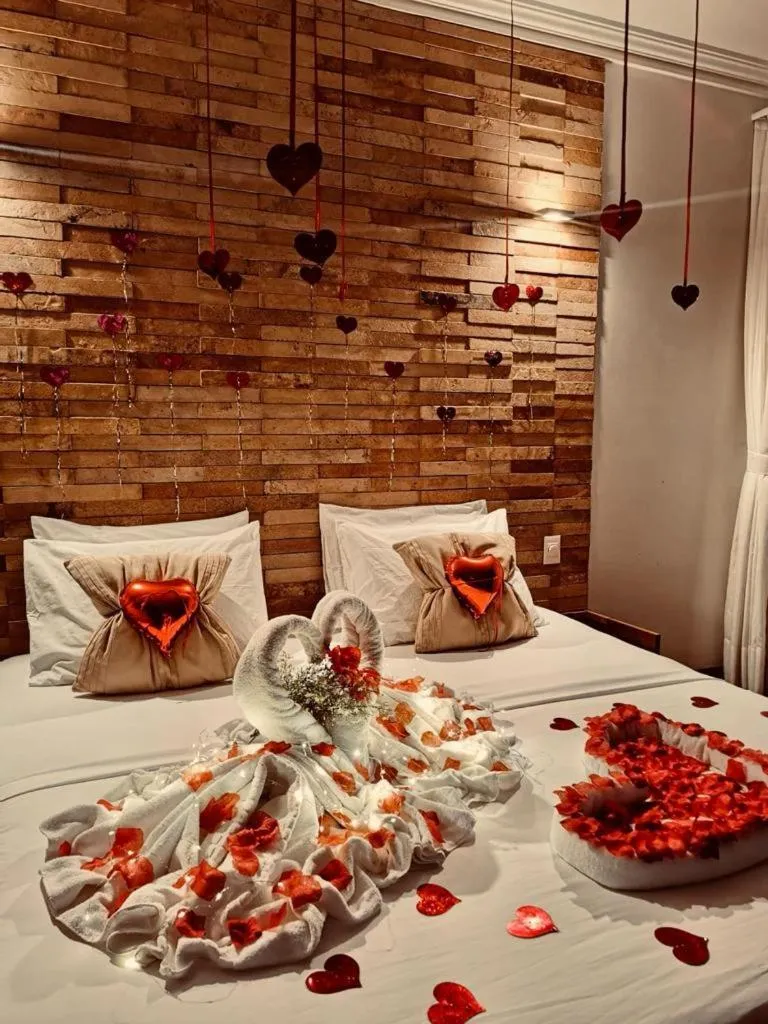 Bed in Pousada Refúgio Jardim de Canoa by Borboleta