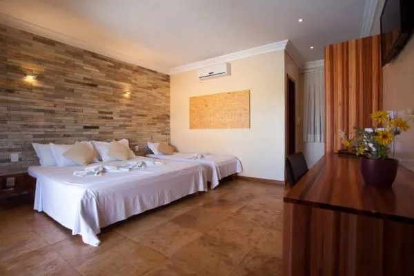 Bed in Pousada Refúgio Jardim de Canoa by Borboleta