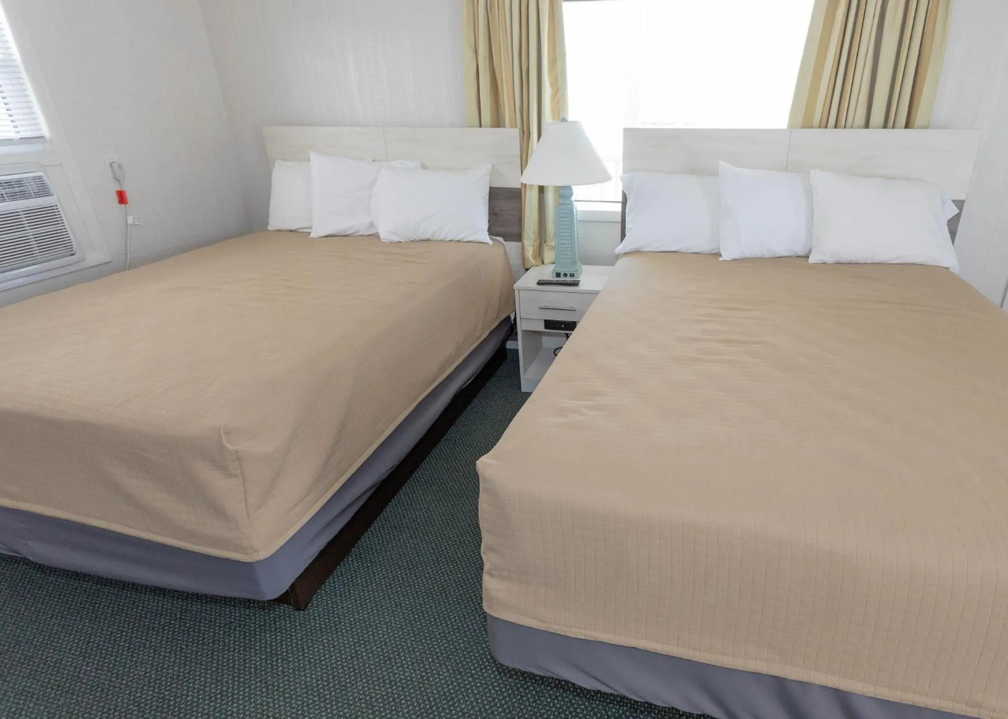 Bed in Fish Tales Boardwalk Inn & Ocean Mecca Motel