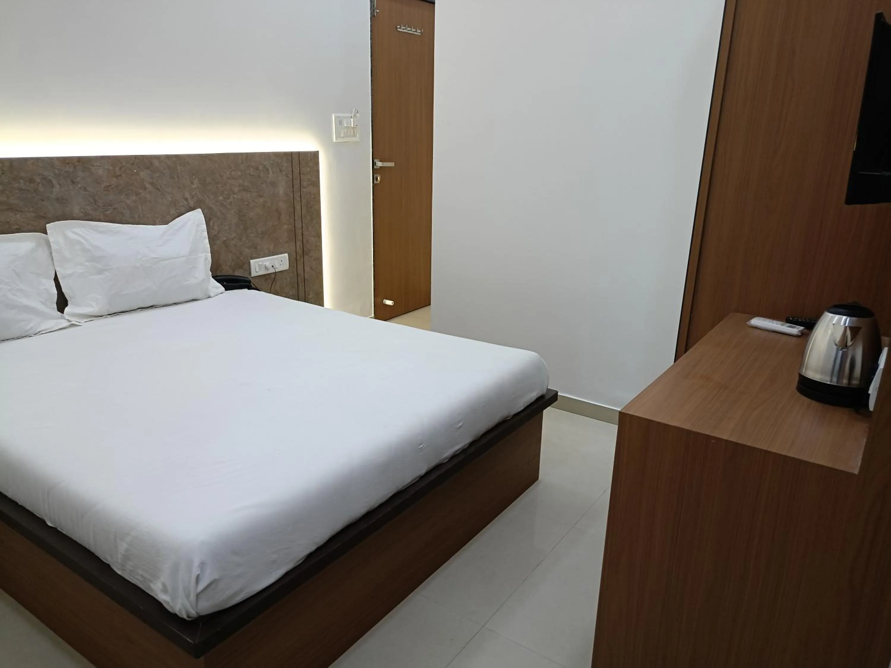 Bed in Hotel Ritz Vesu - Hotels in Vesu, Surat