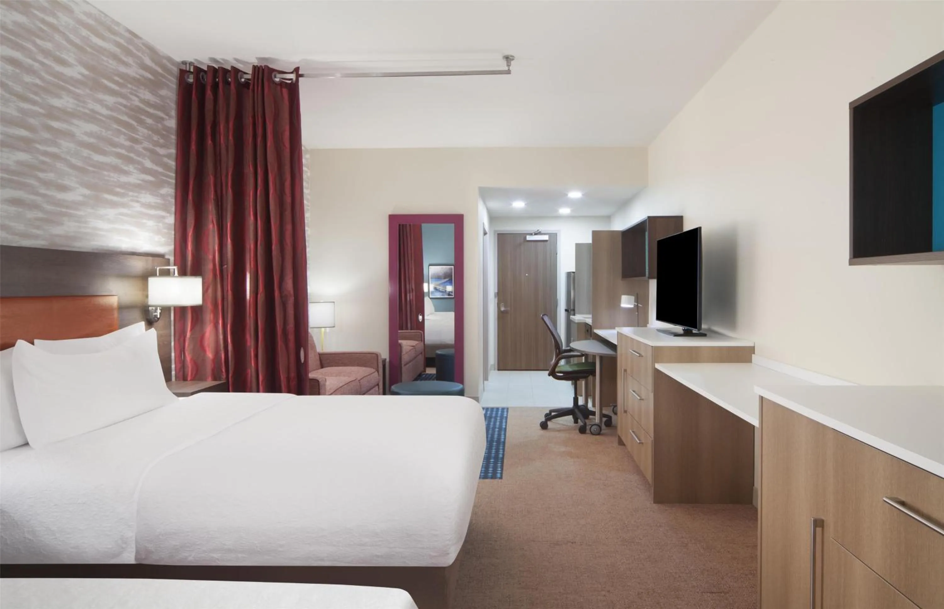 Living room, Bed in Home2 Suites By Hilton Jackson