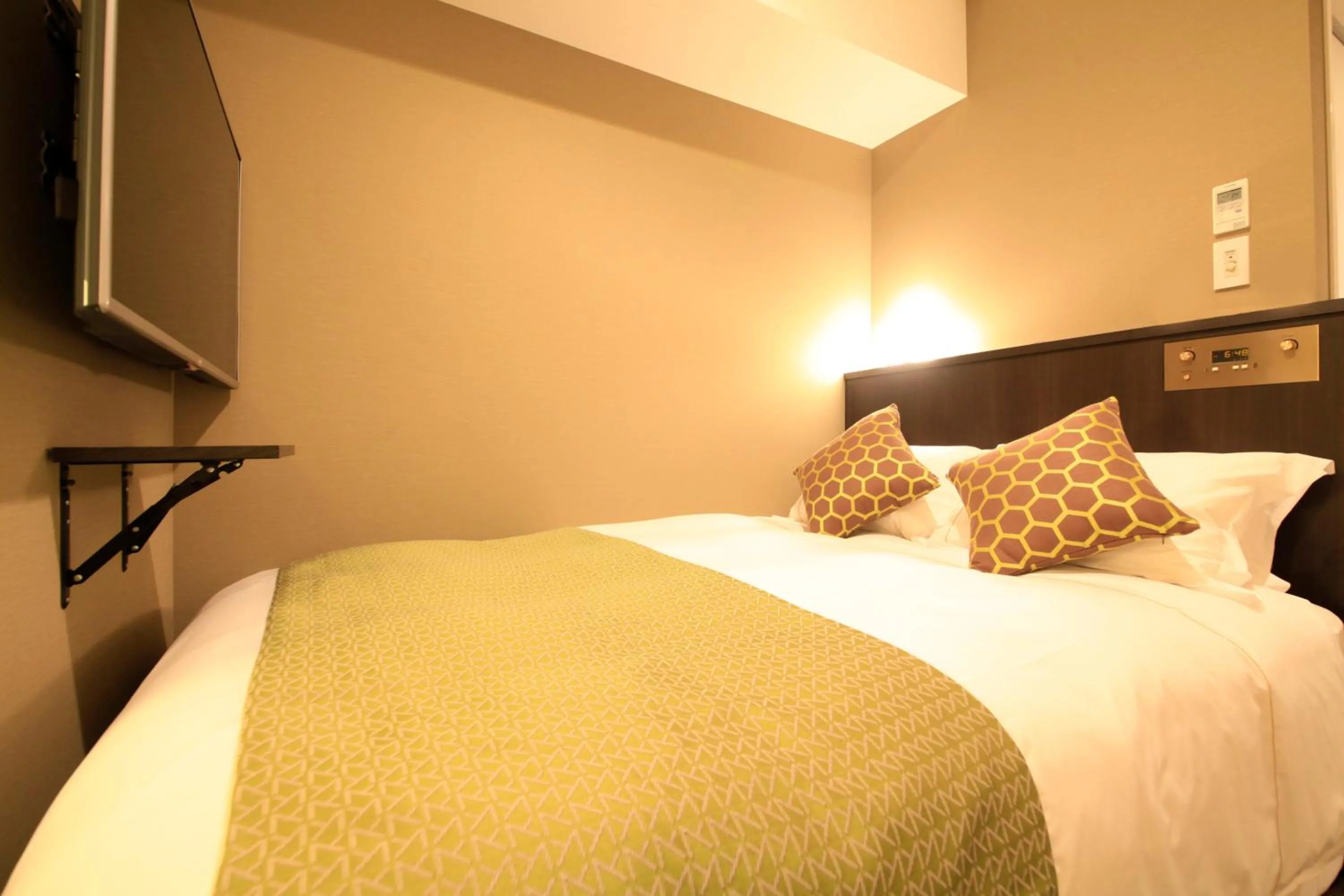 Photo of the whole room, Bed in Centurion Hotel Ikebukuro Station