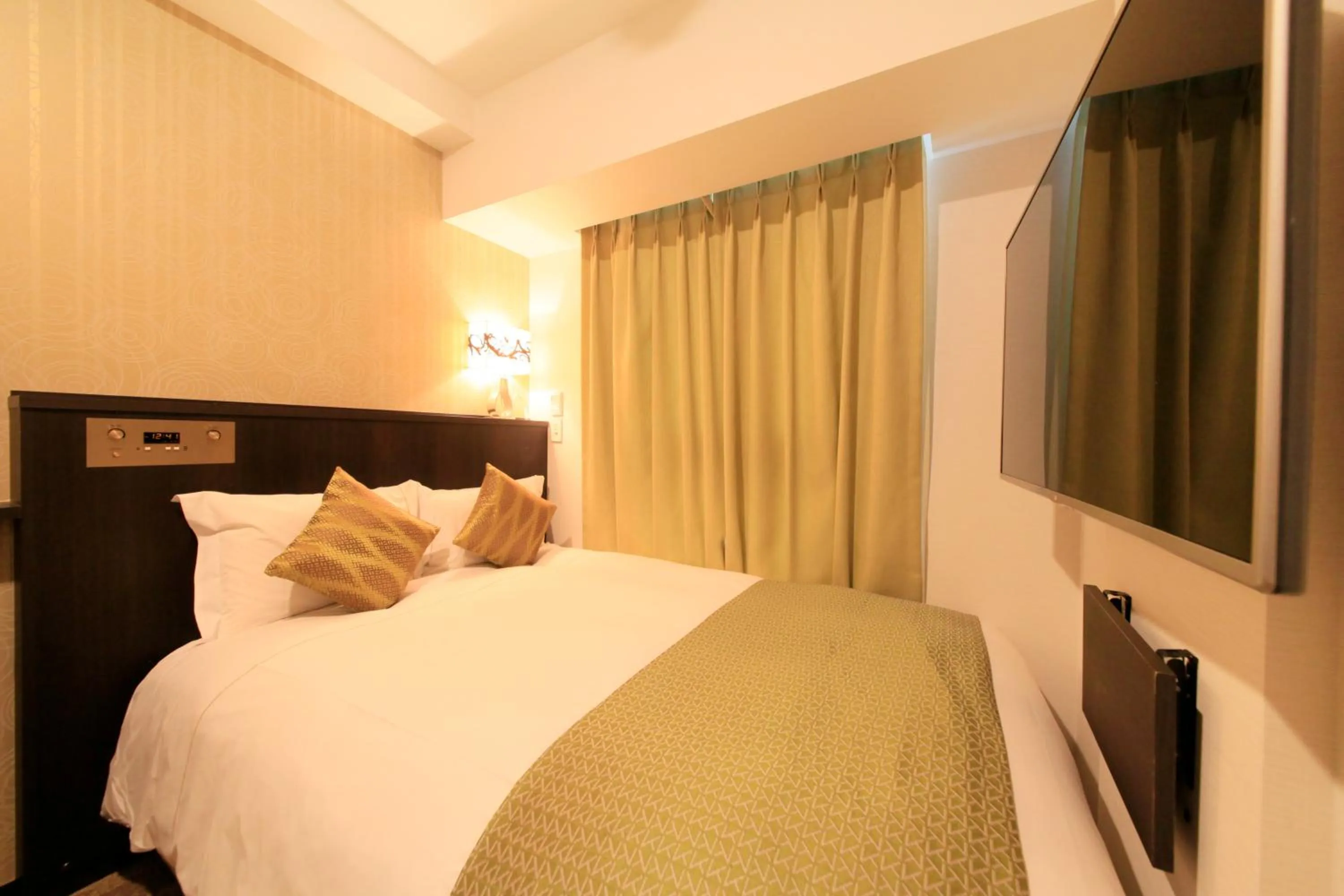 Photo of the whole room, Bed in Centurion Hotel Ikebukuro Station