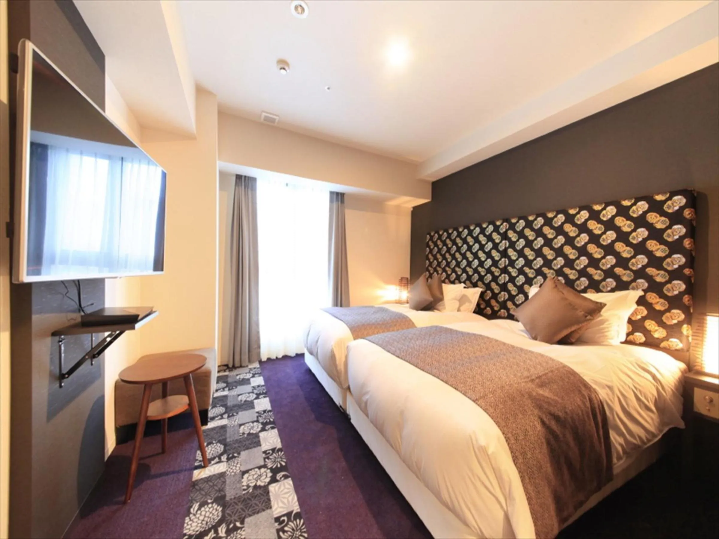 Bed in Centurion Hotel Ikebukuro Station