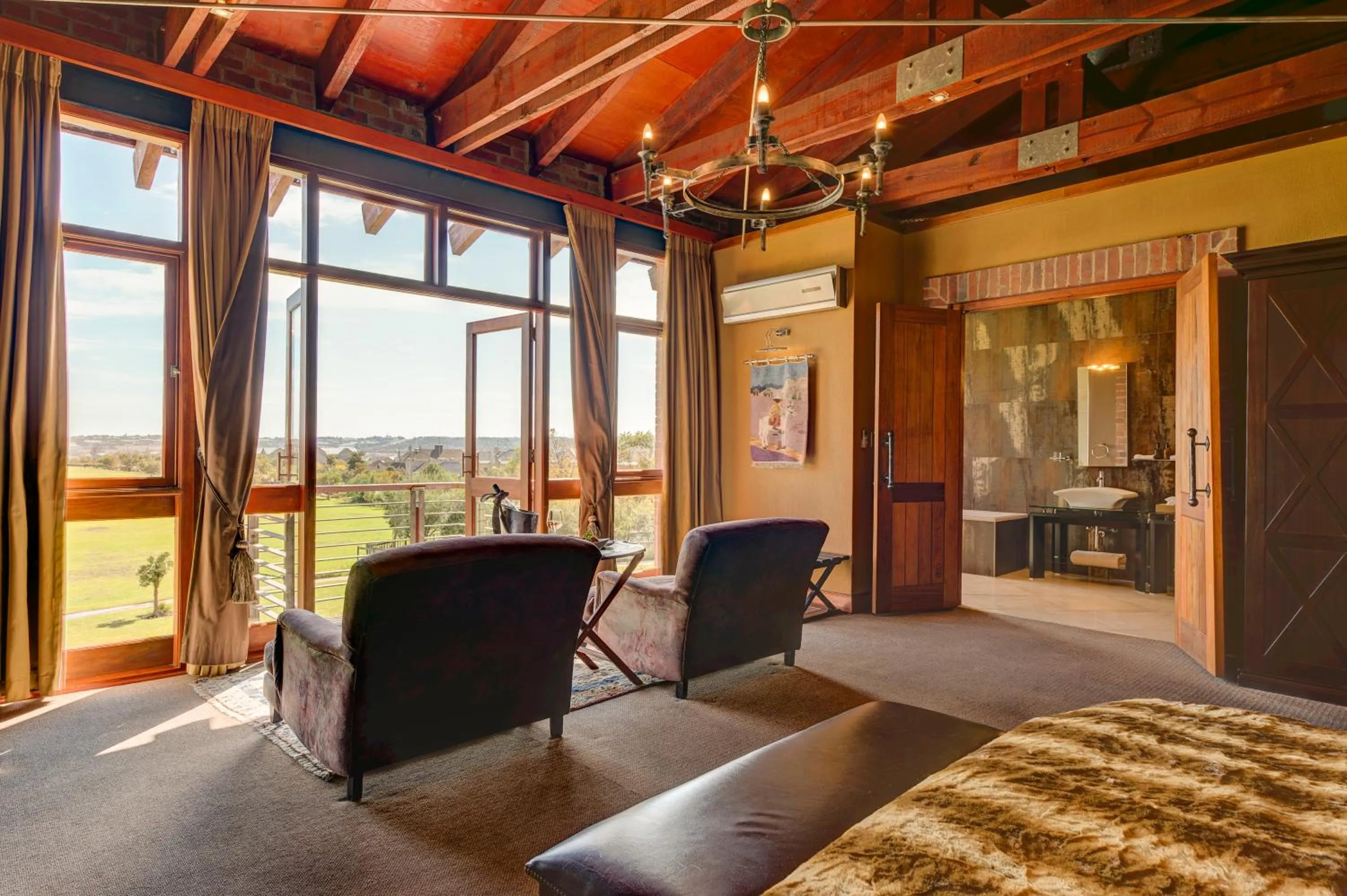 Seating area, Bed in Riboville Boutique Hotel And Restaurant