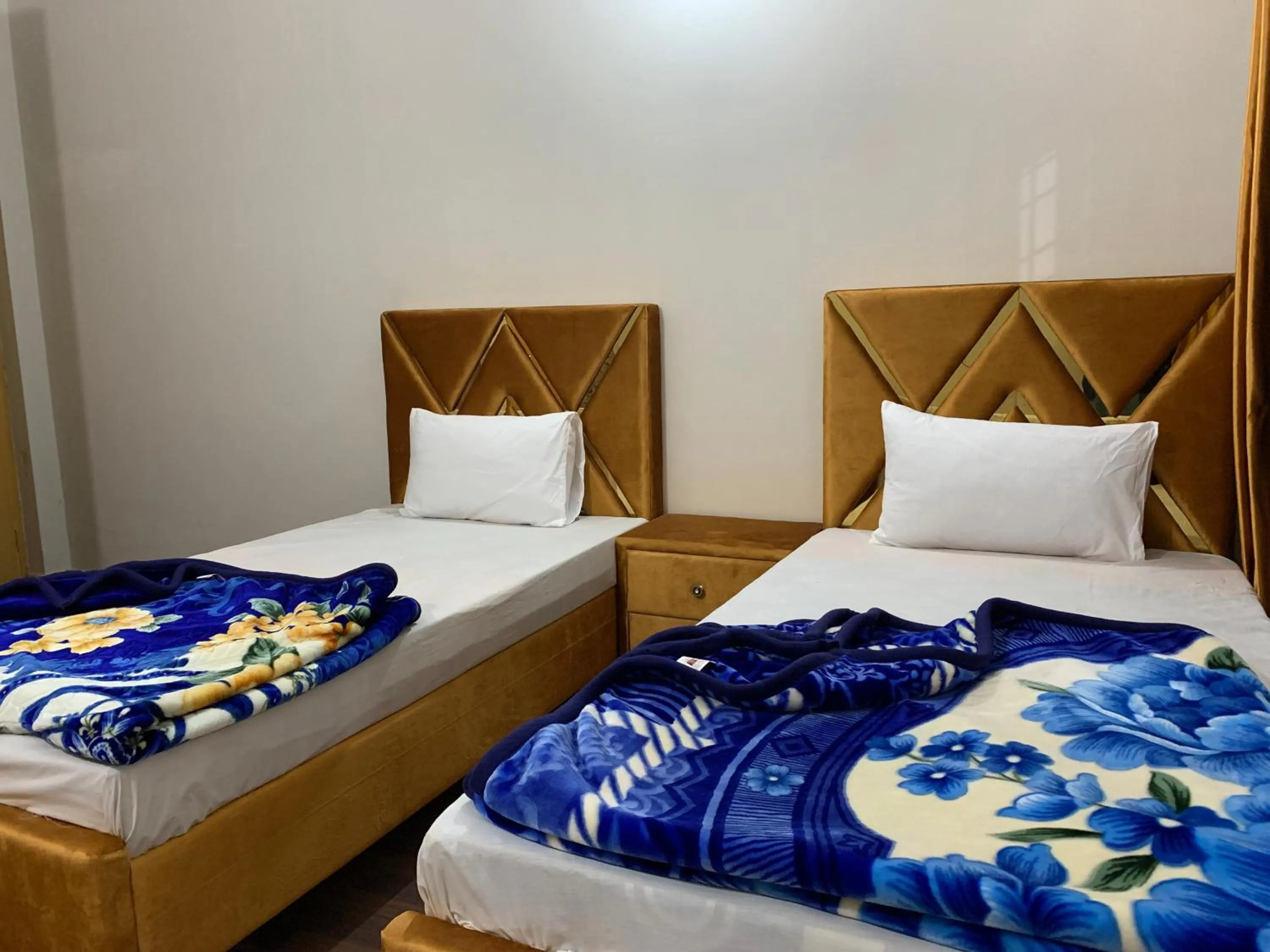 Bed in Eden Plus Executive Hotel