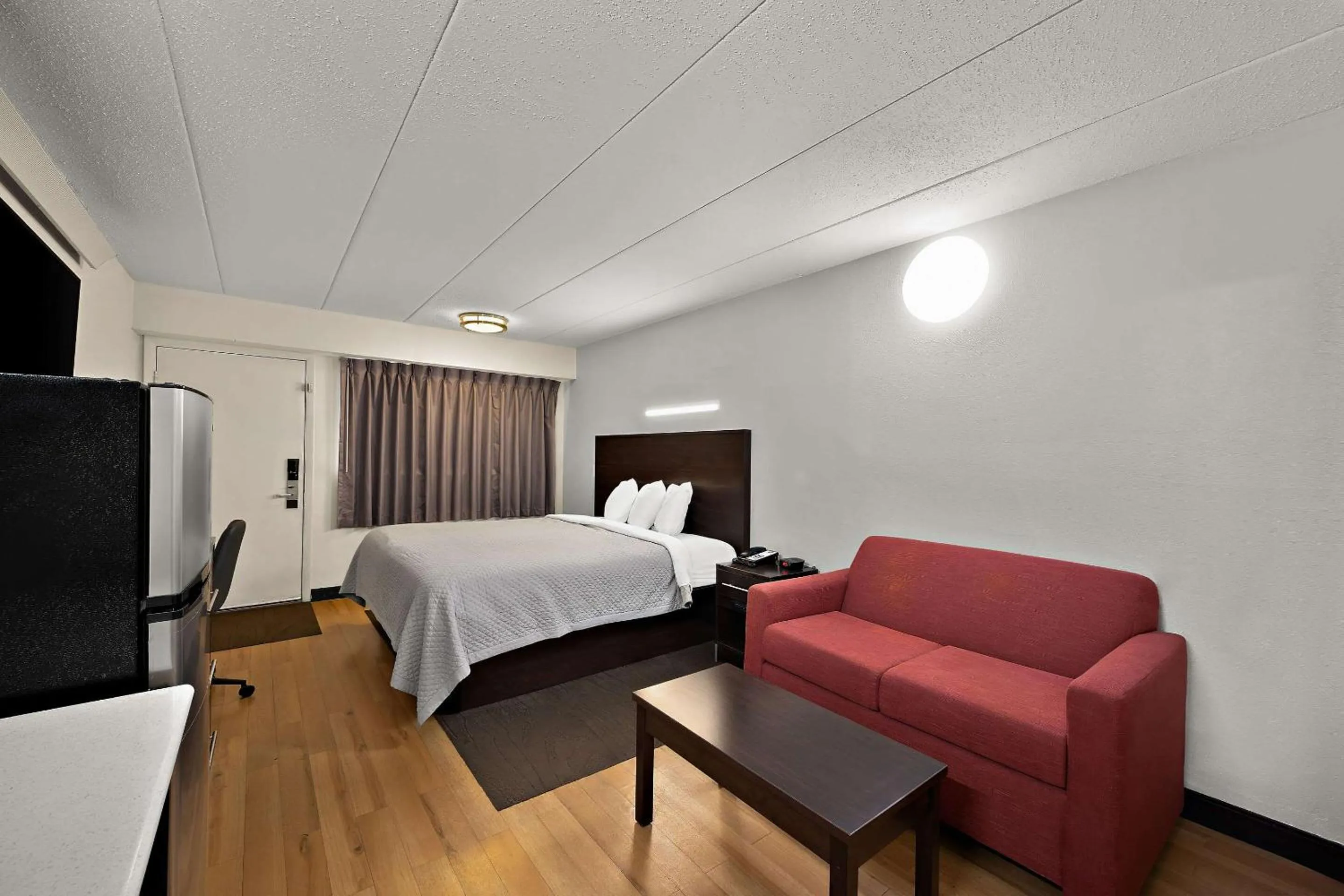 Bedroom, Bed in Suburban Studios Peoria