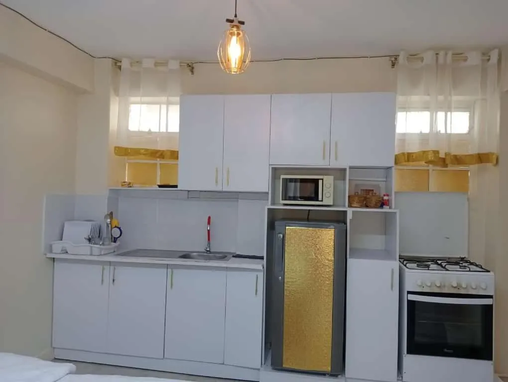 Kitchen or kitchenette in Airport Studio Apartments-JKIA