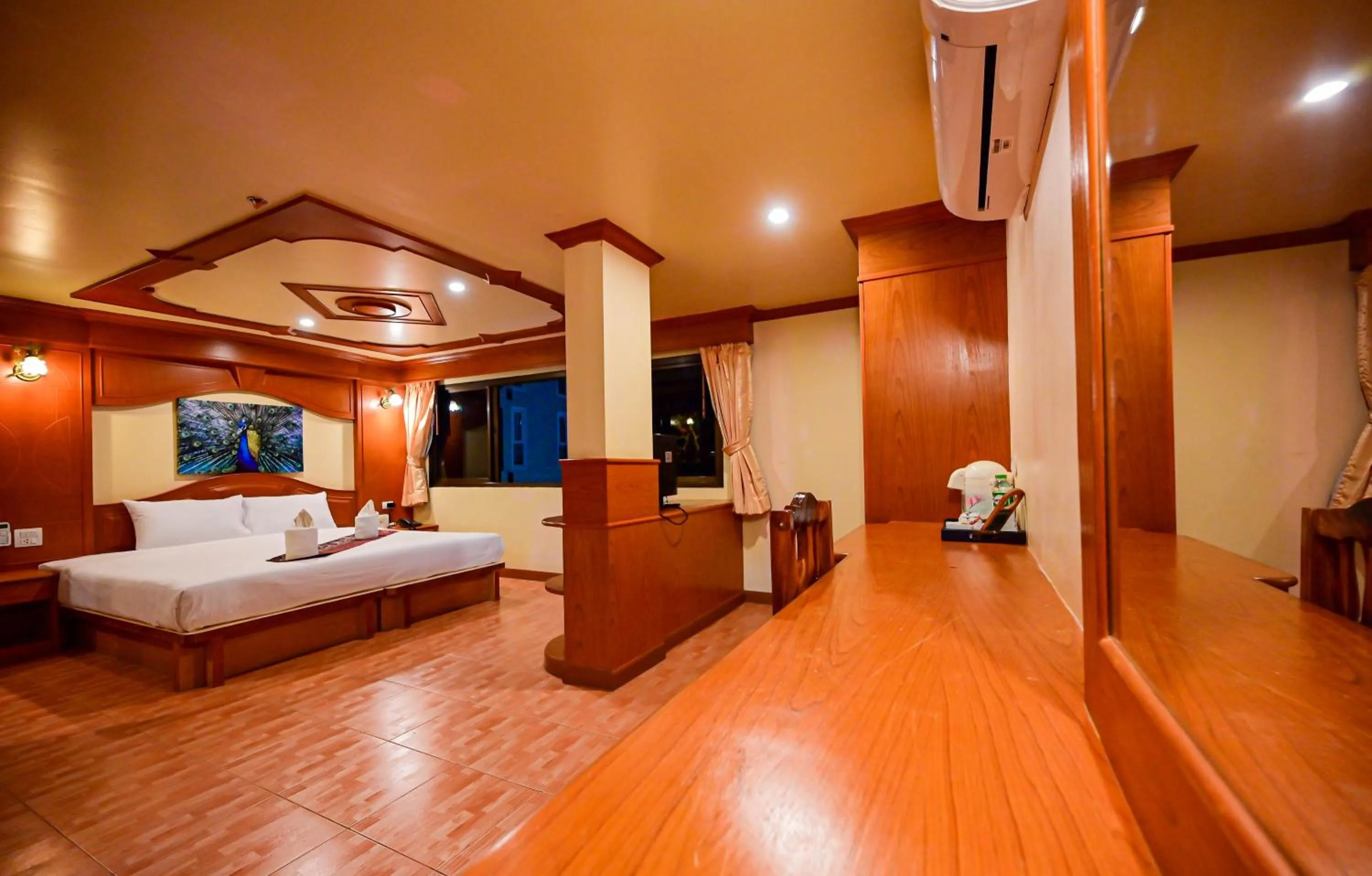 Bed in Tiger Complex Hotel