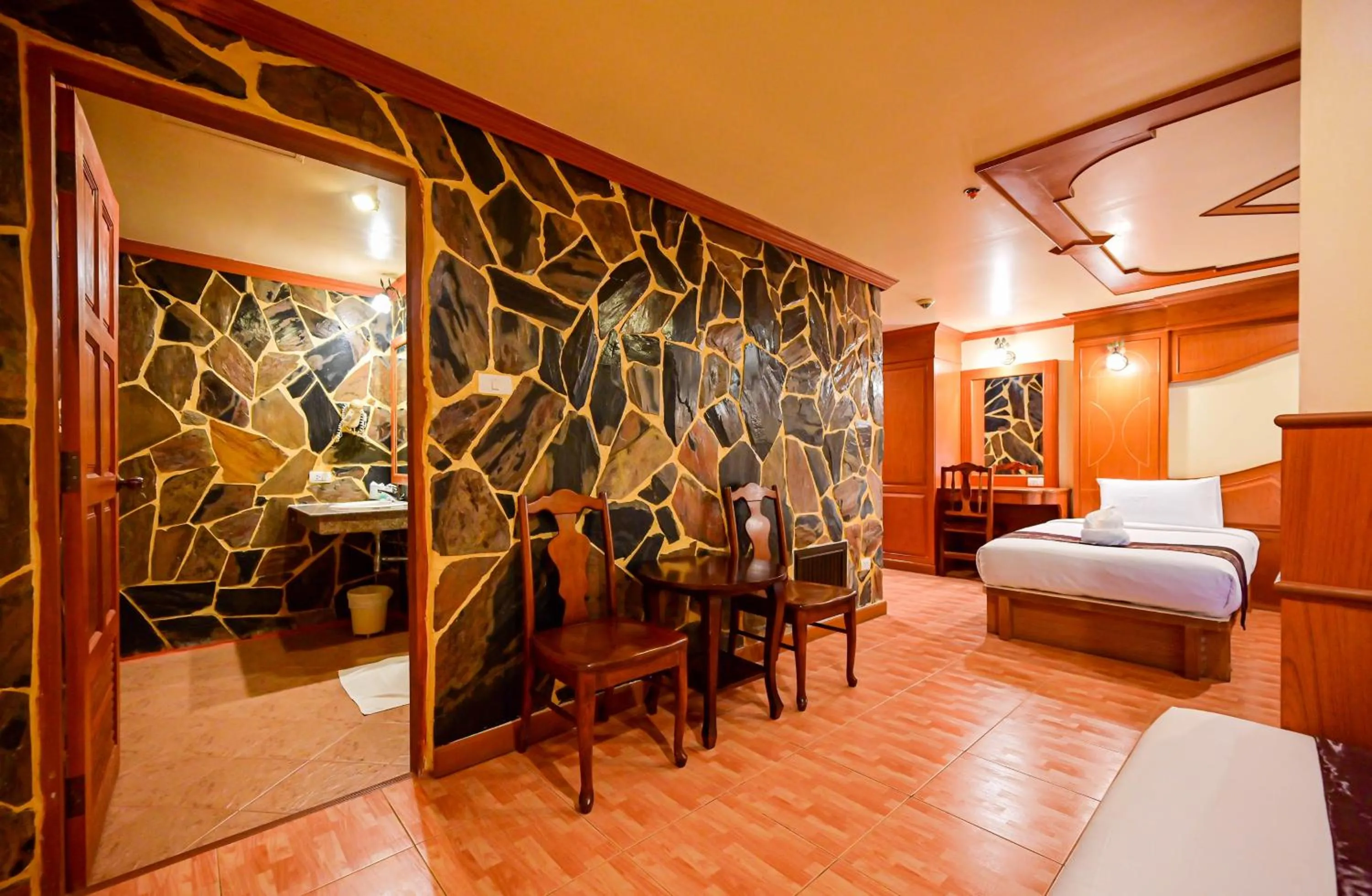 Bed in Tiger Complex Hotel