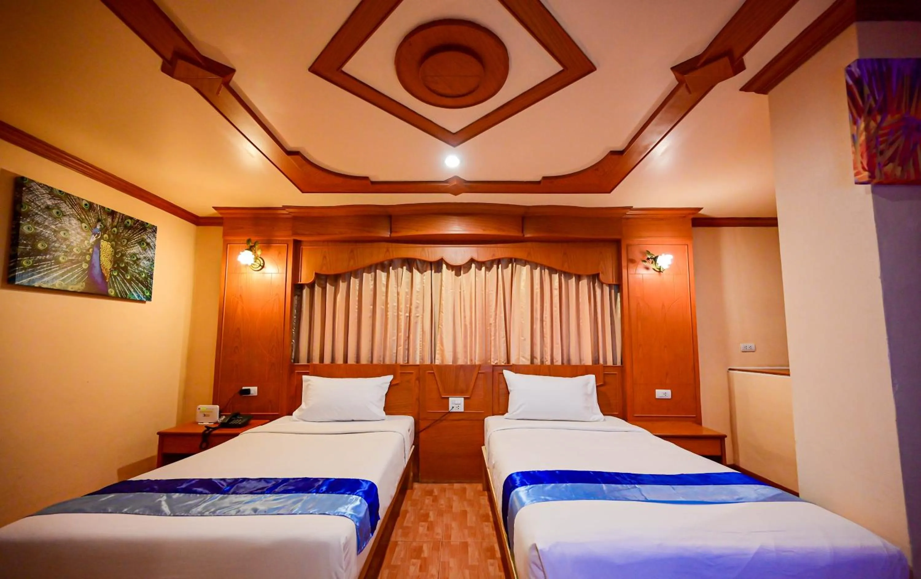 Bed in Tiger Complex Hotel