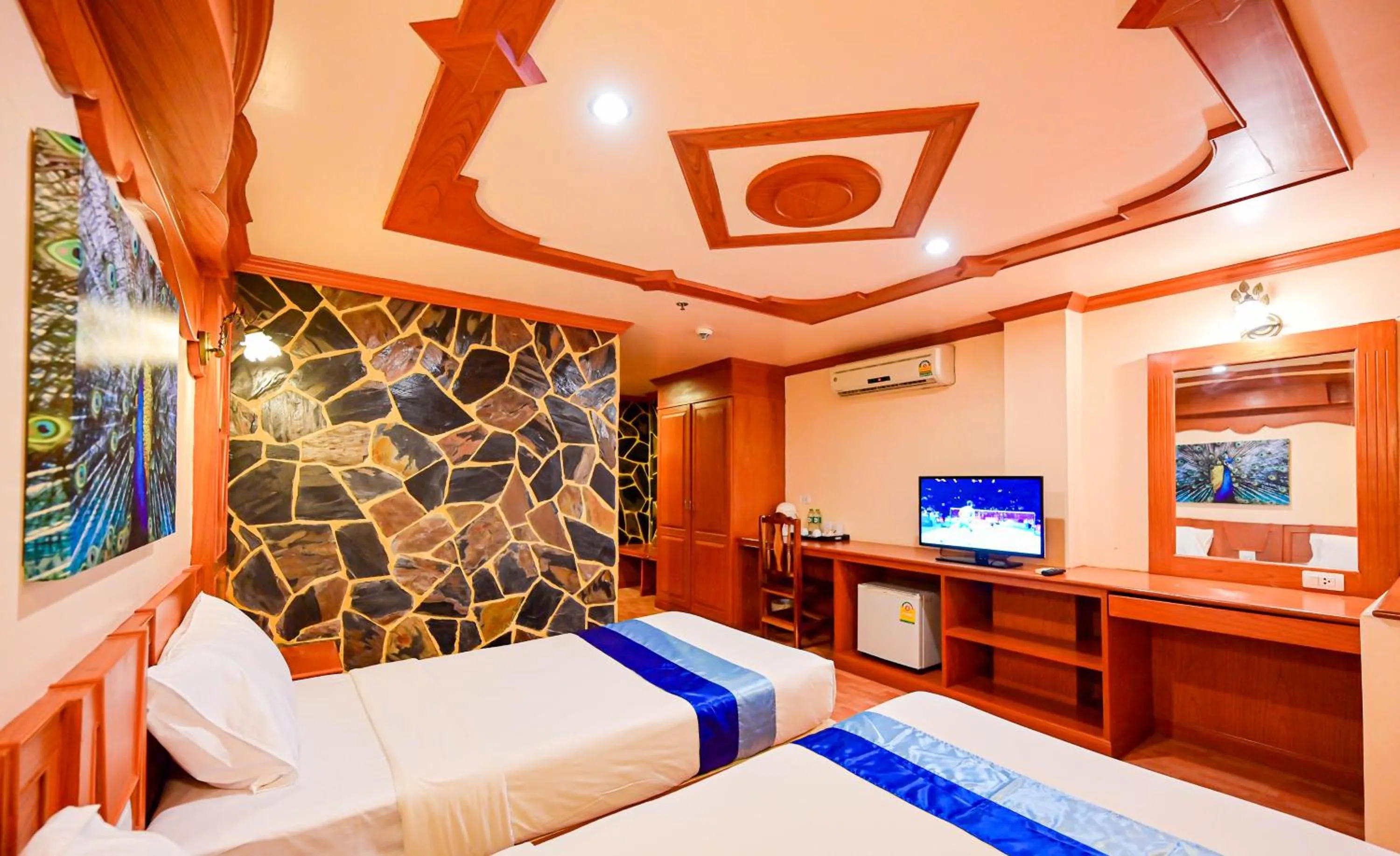 Bed in Tiger Complex Hotel