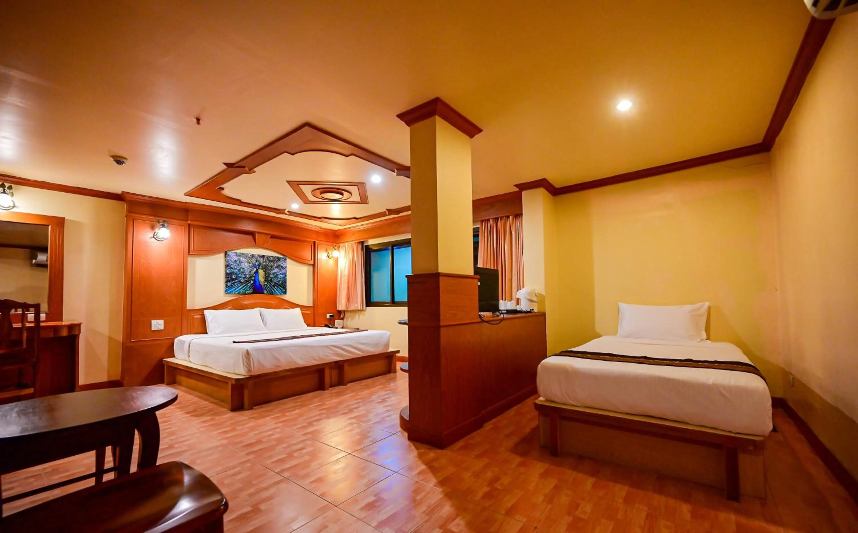 Bed in Tiger Complex Hotel