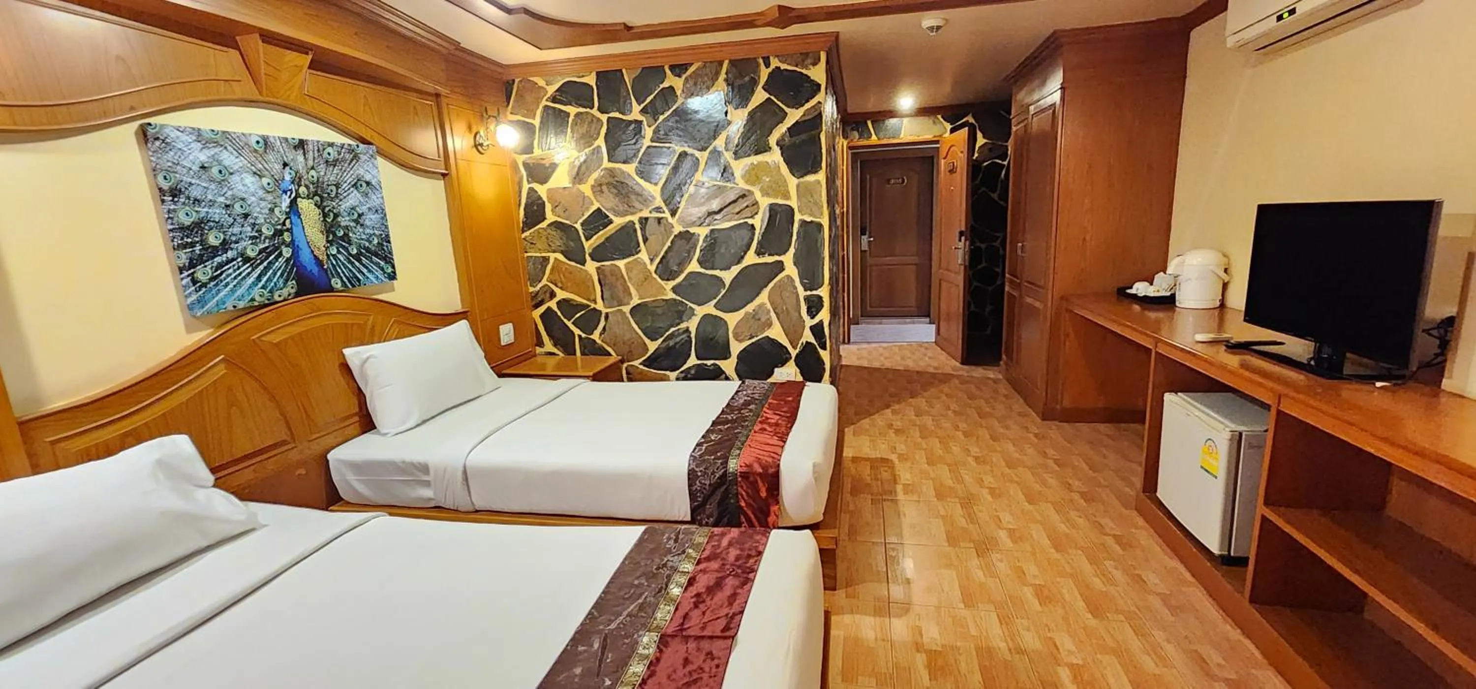 Bedroom in Tiger Complex Hotel