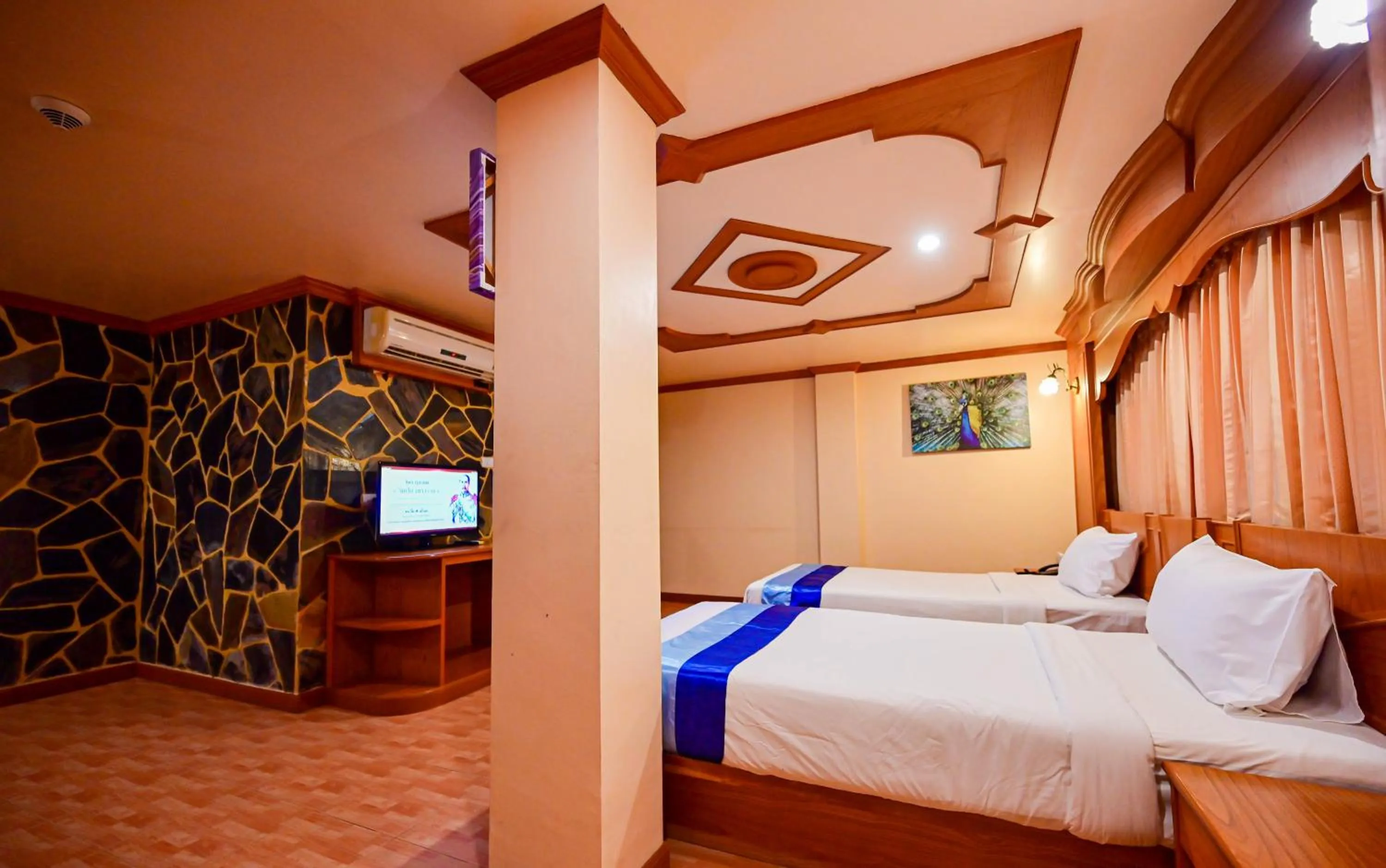 Bed in Tiger Complex Hotel