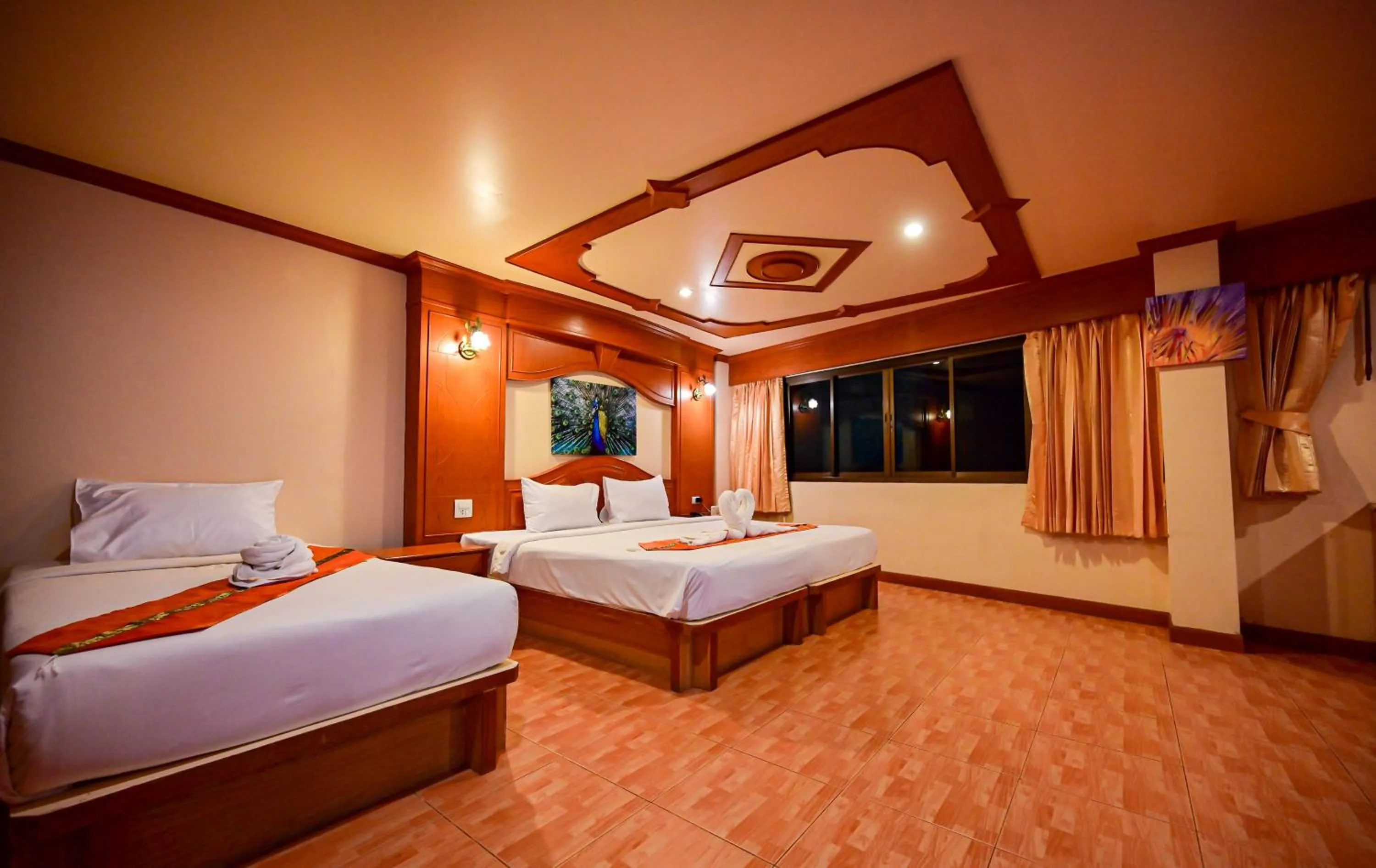 Bed in Tiger Complex Hotel