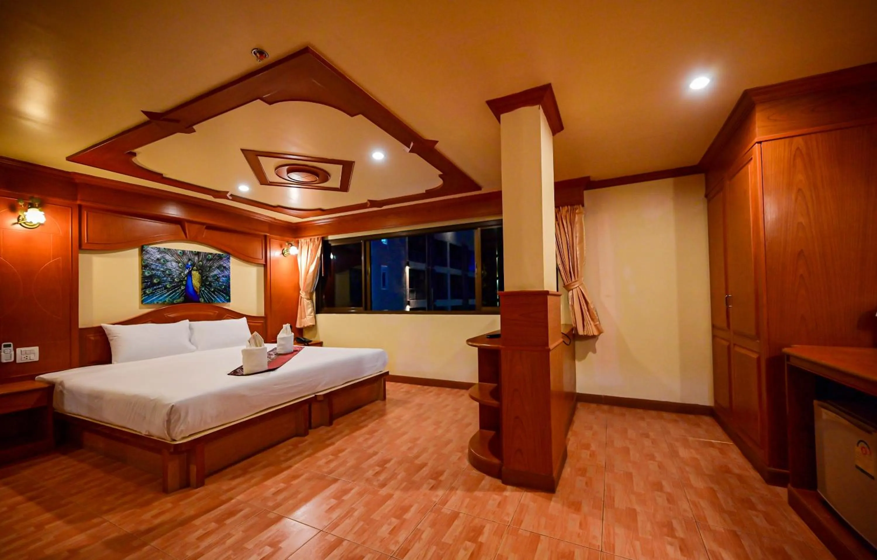 Bed in Tiger Complex Hotel