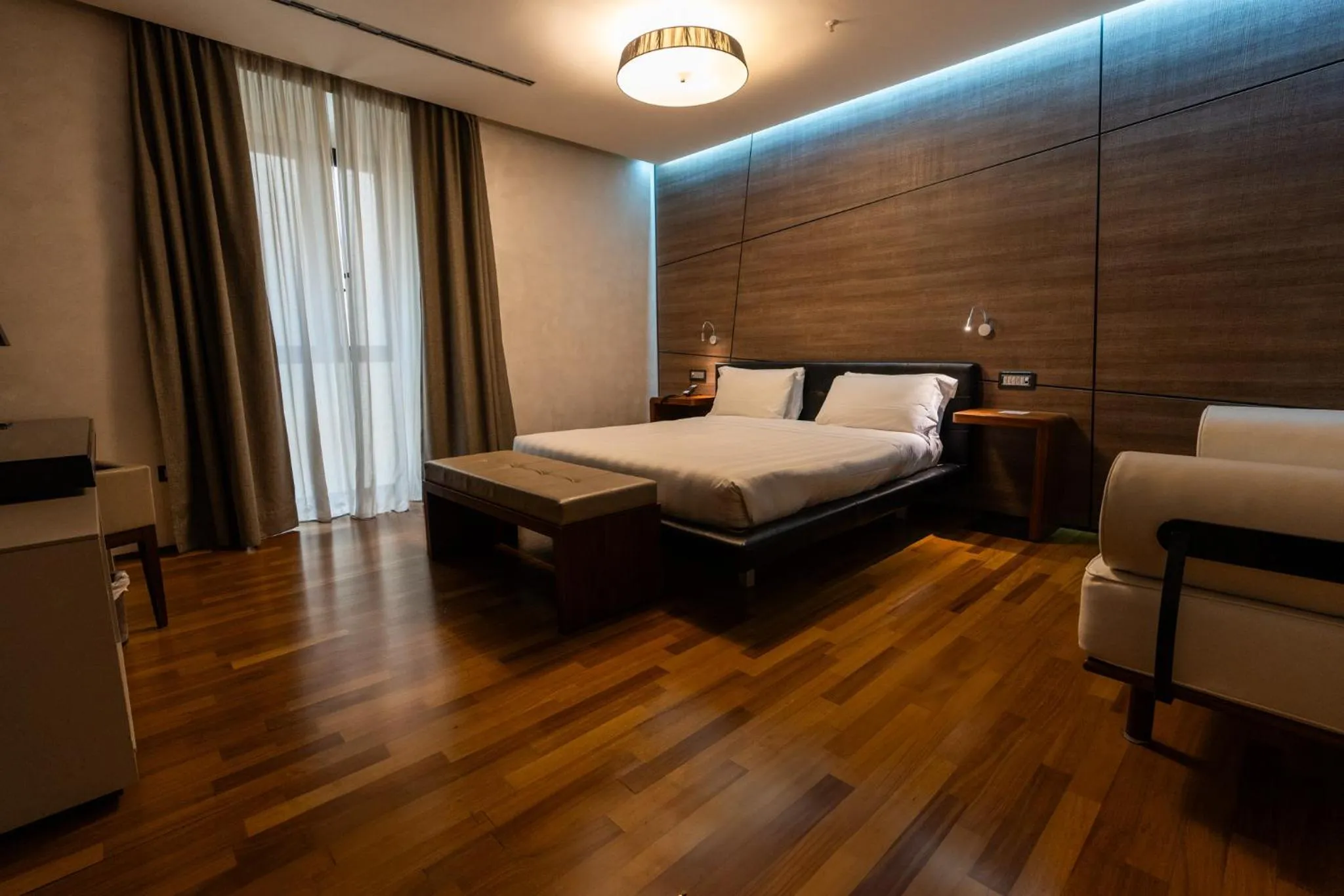 Bed in Divina Luxury Hotel
