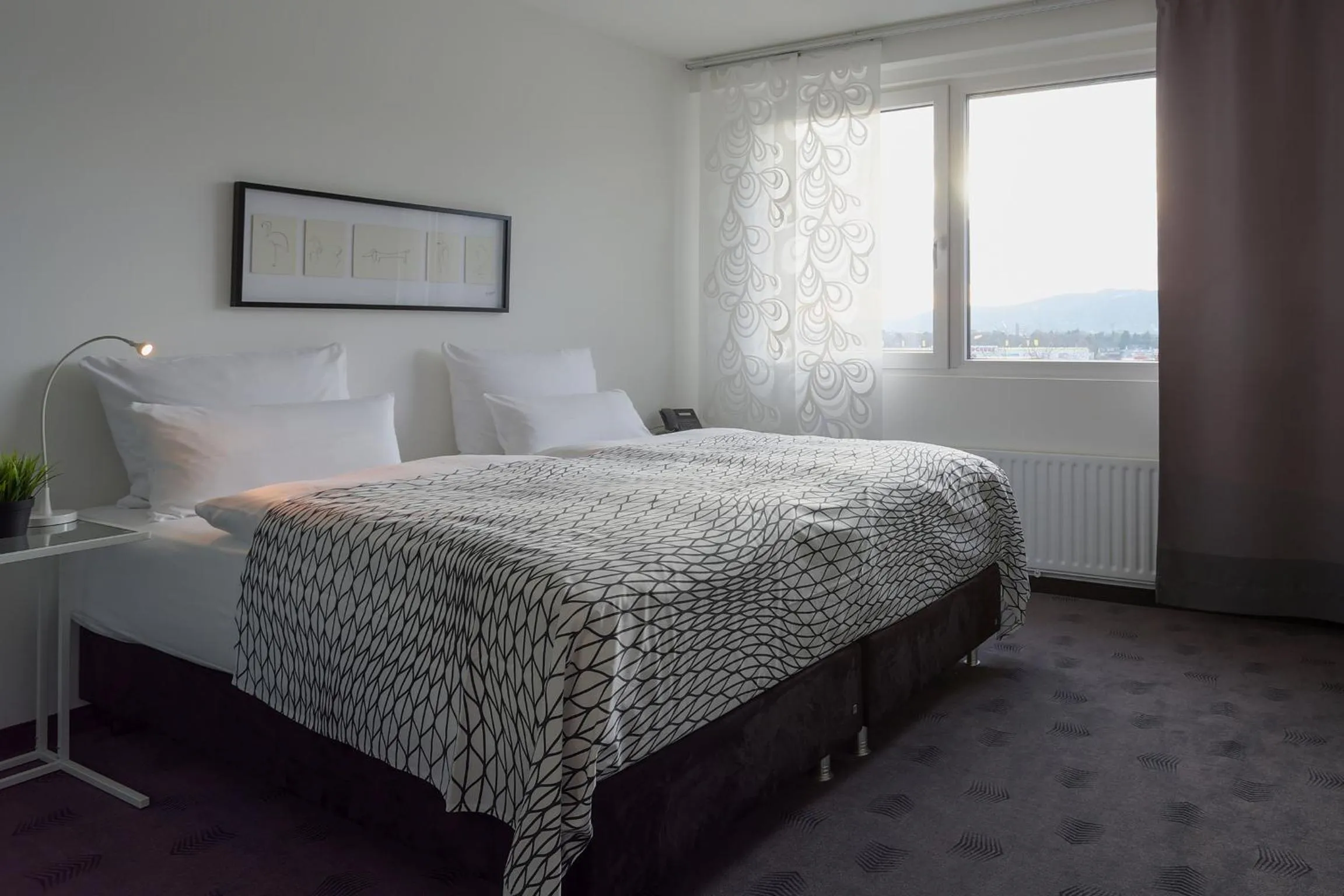 Photo of the whole room, Bed in FourSide Plaza Hotel Trier, Trademark Collection by Wyndham