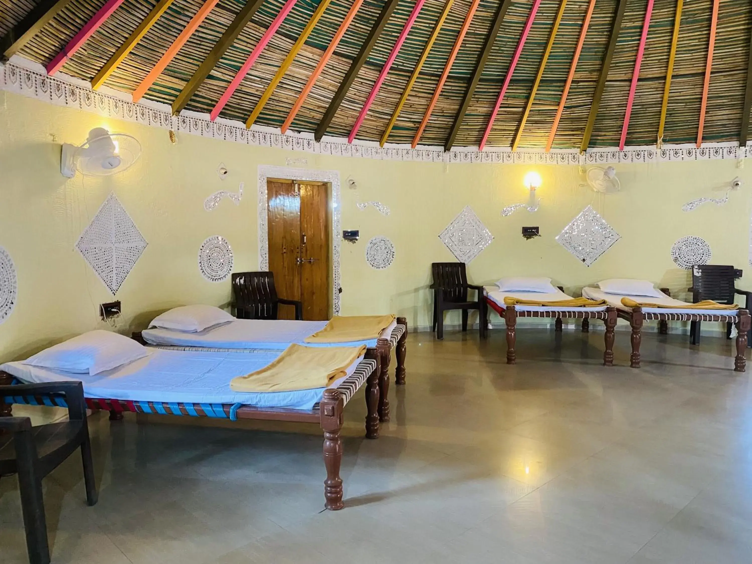 Bed in Santkrupa Villa Resort Bed in Santkrupa Villa Resort