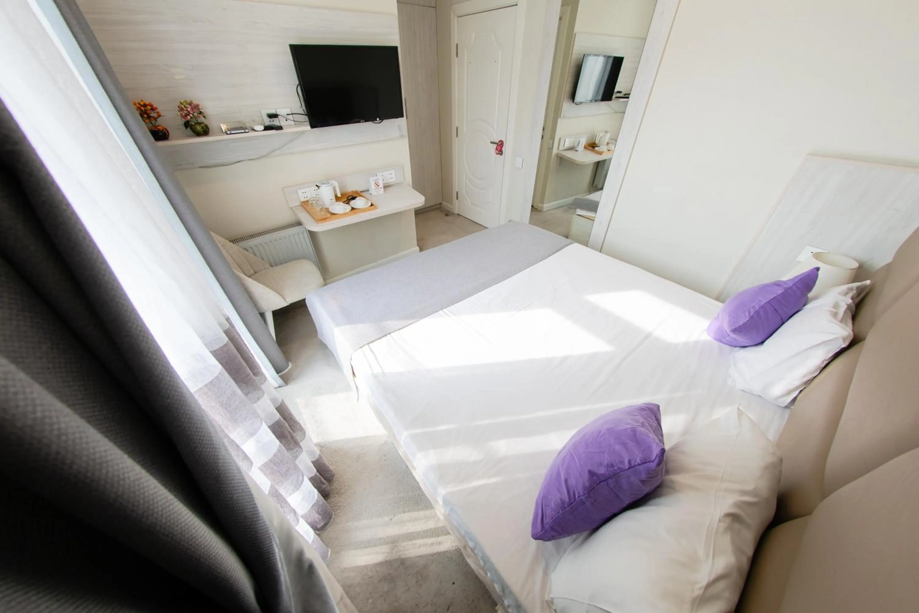 Bed in Zimmer Boutique Hotel