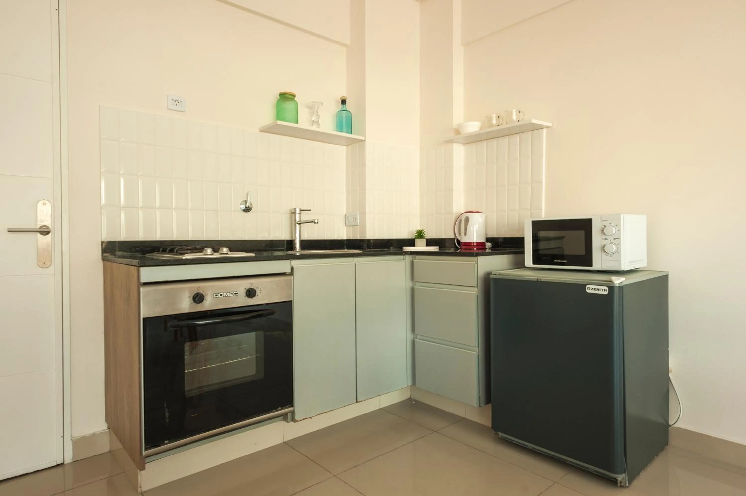 Kitchen or kitchenette in Báltico Suites