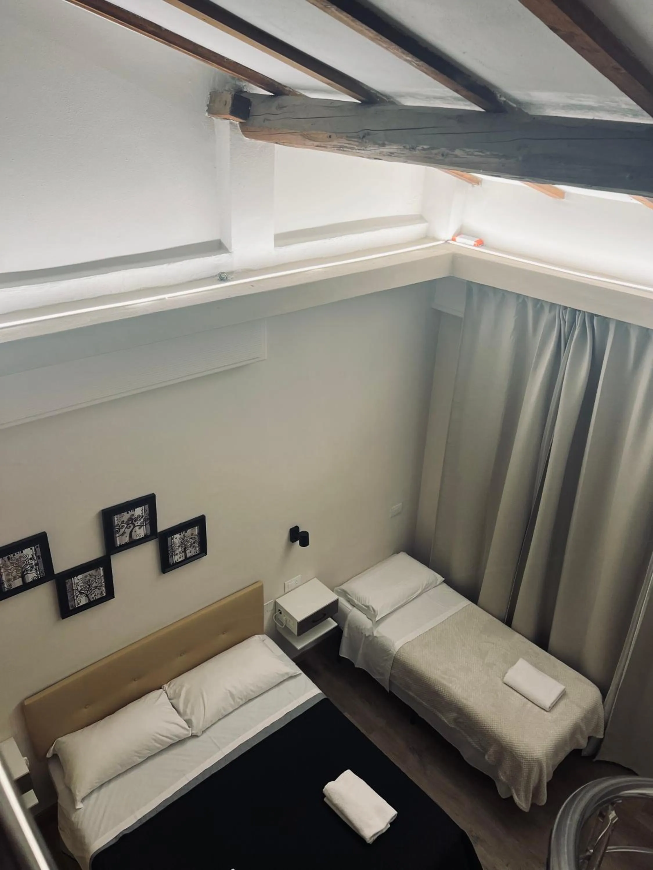 Bed in Il Galileo Rooms