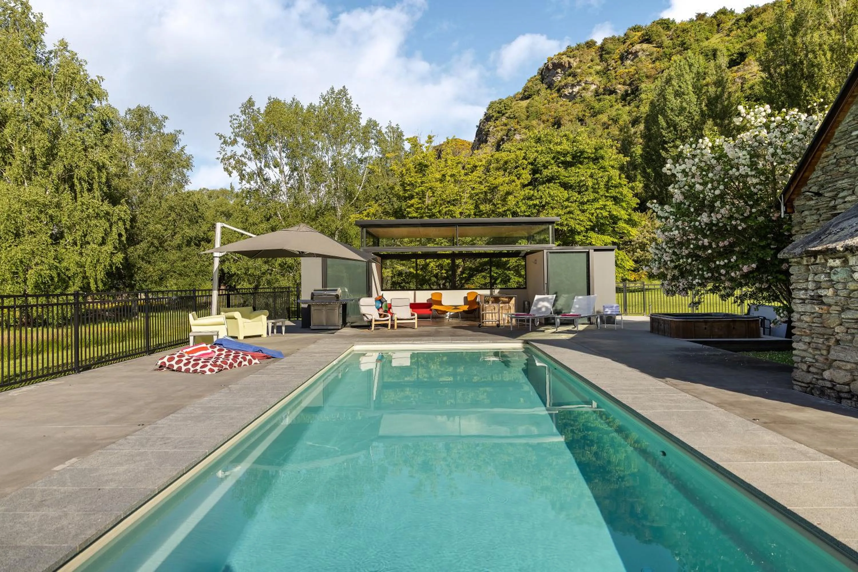 Swimming pool in Wharenui Holiday Home by MajorDomo
