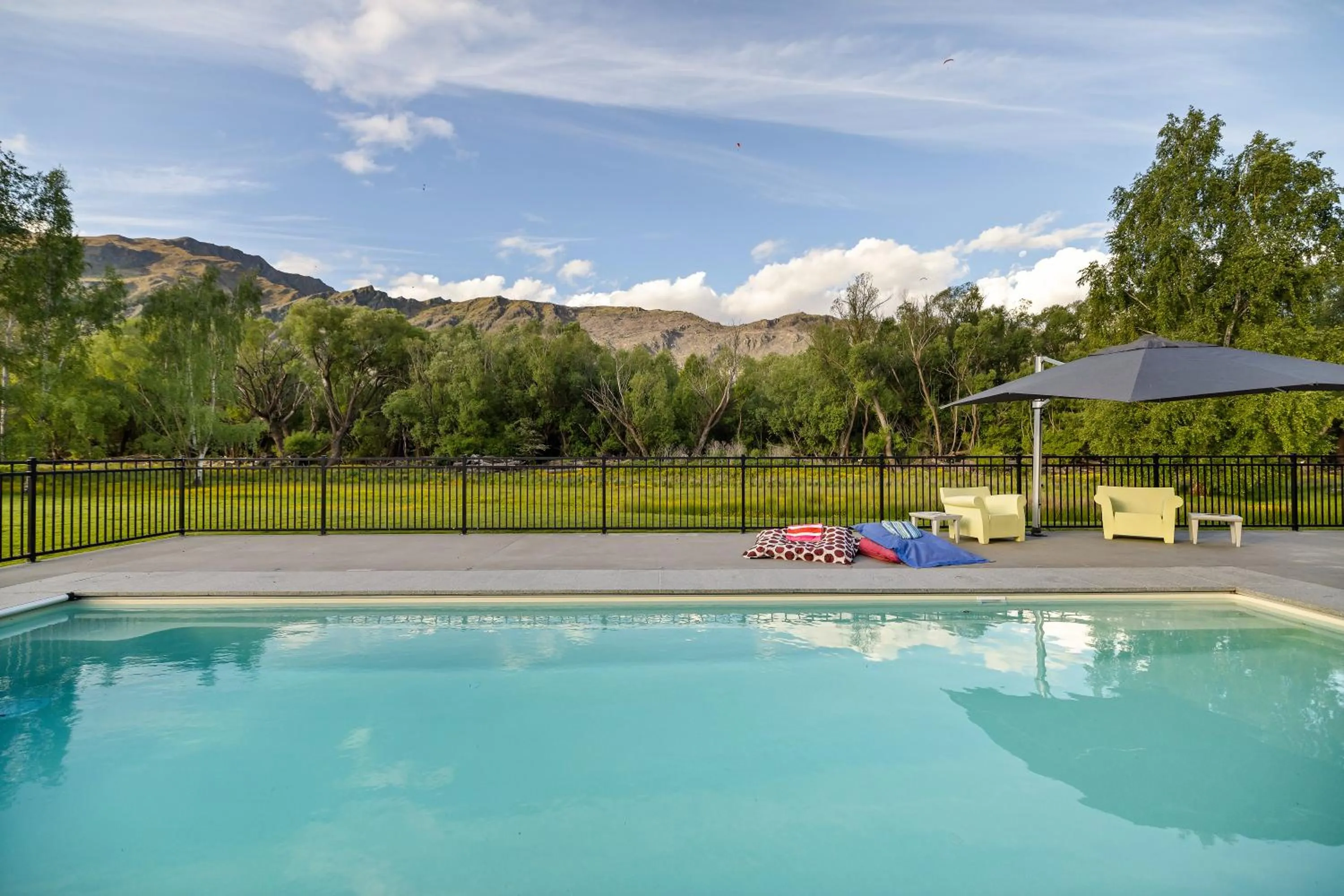 Swimming pool in Wharenui Holiday Home by MajorDomo