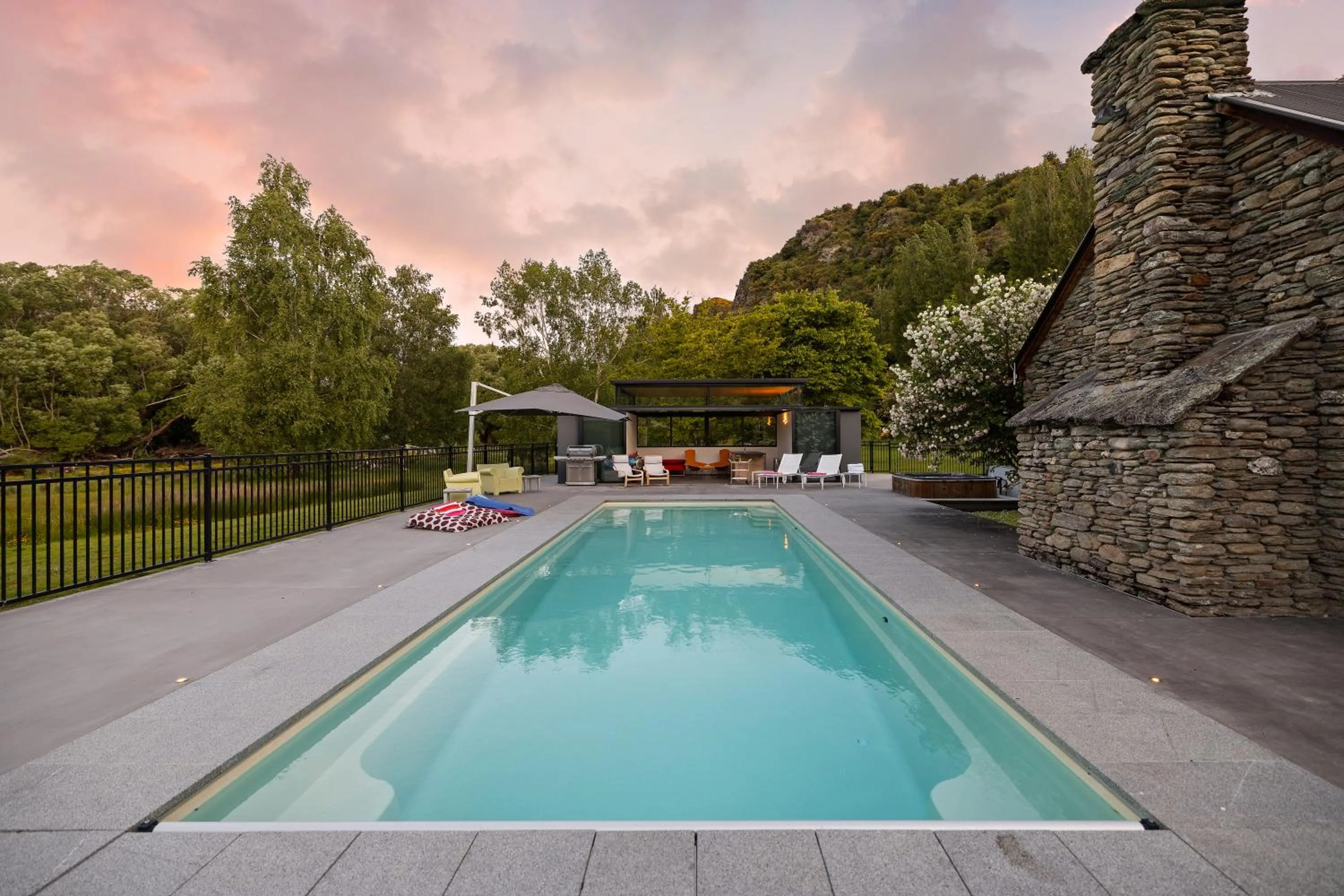 Swimming pool in Wharenui Holiday Home by MajorDomo