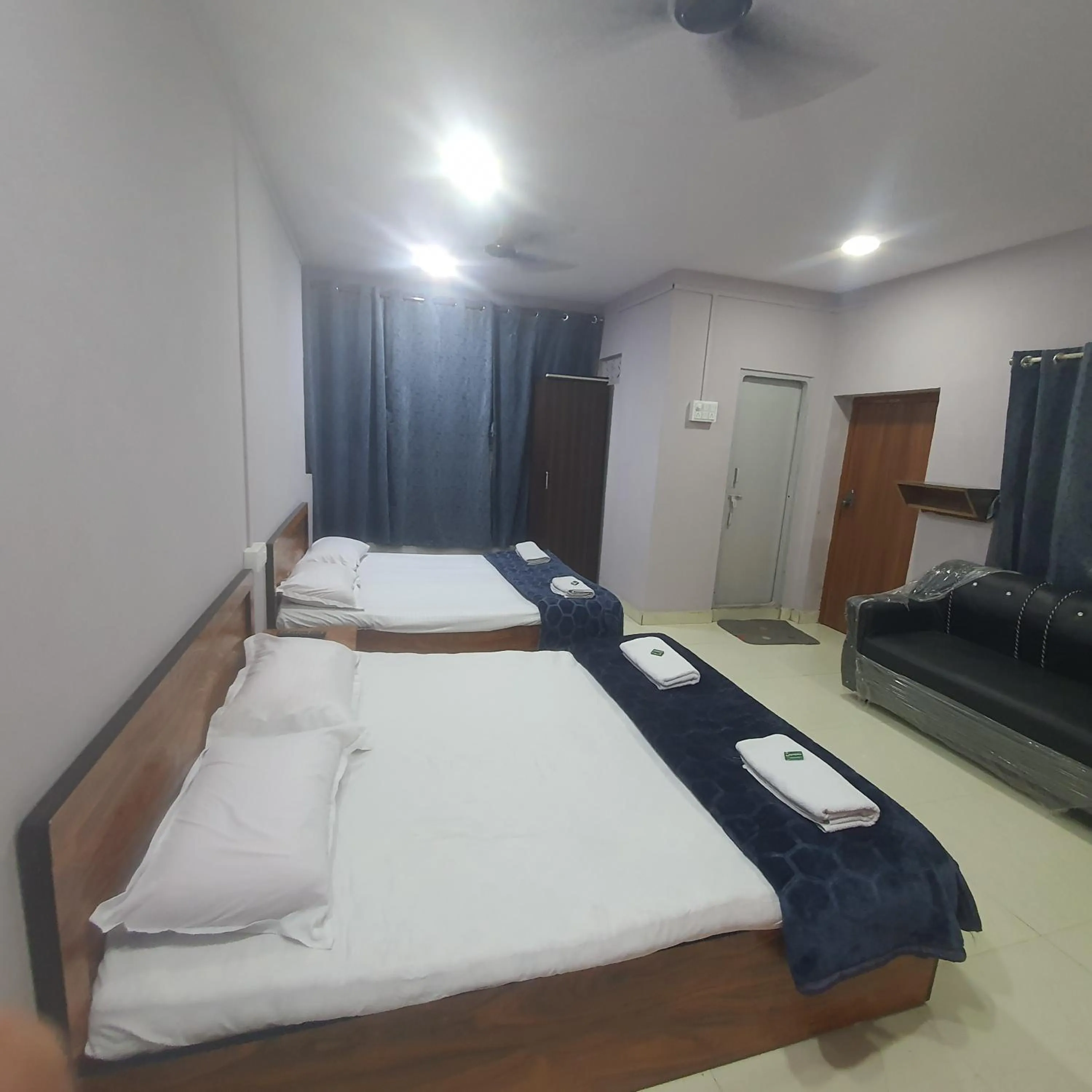 Bed in Hotel Family Stay Beside Railway Station