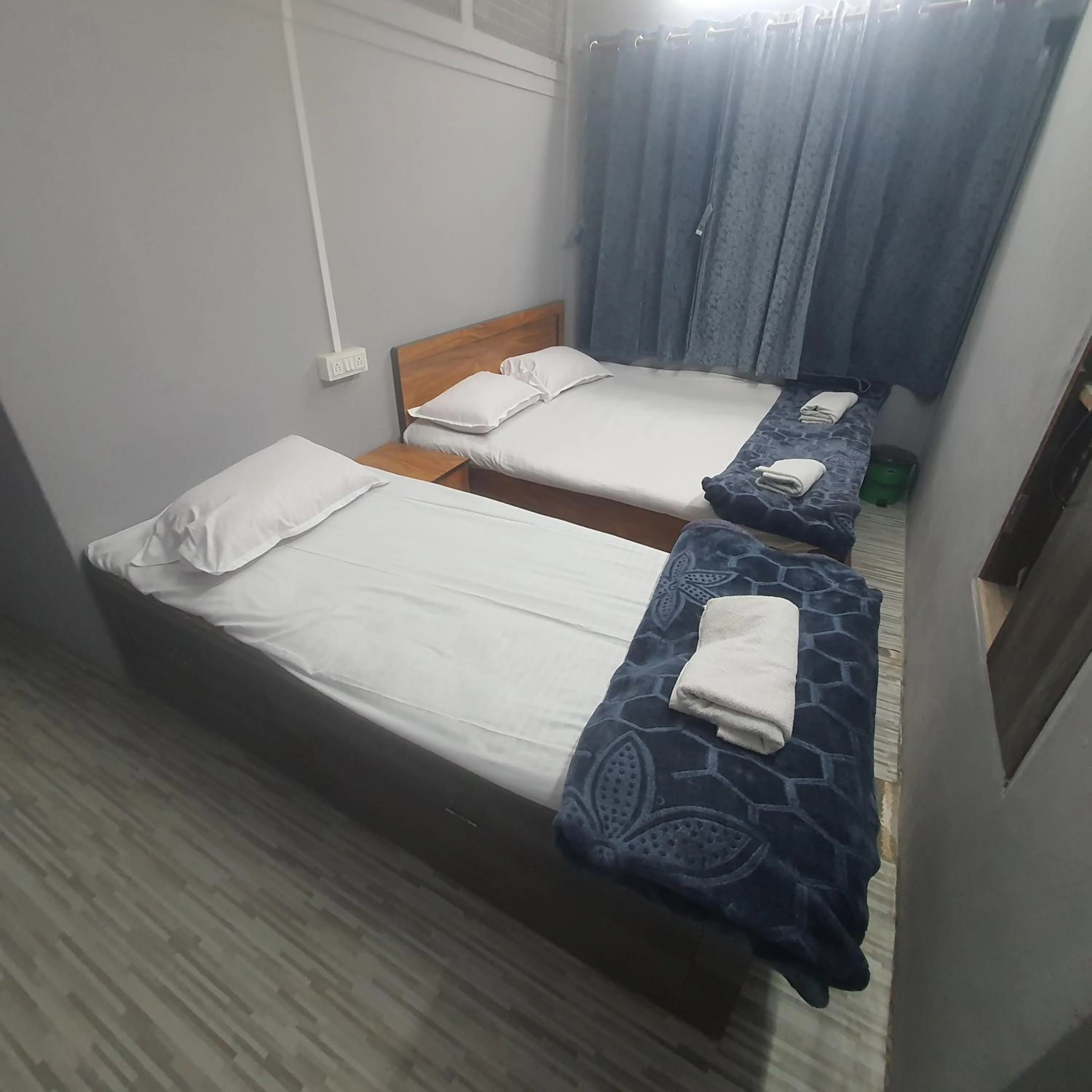 Bed in Hotel Family Stay Beside Railway Station