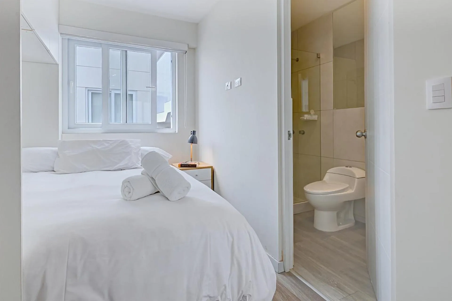 Bed in Quark Apartments