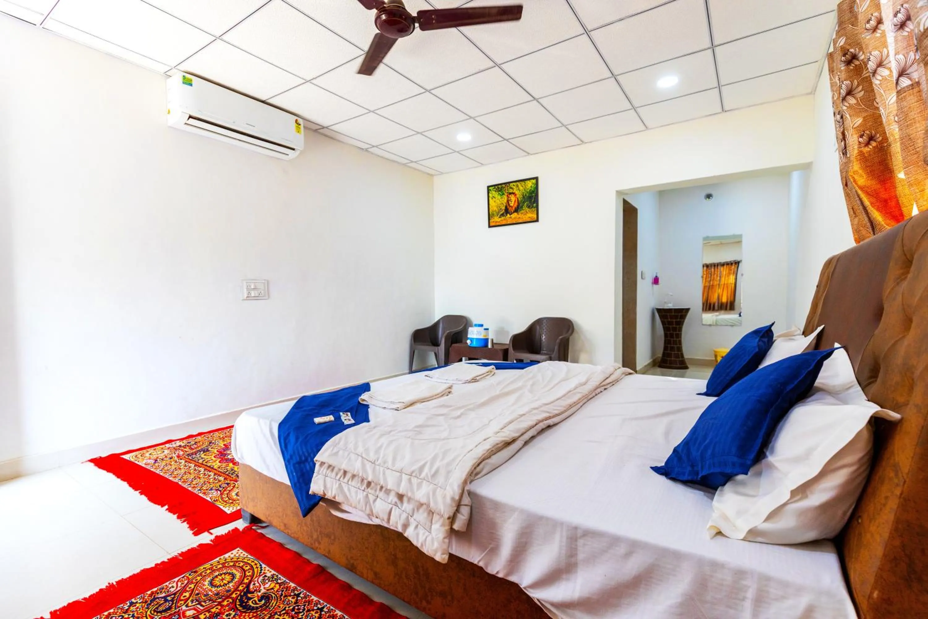 Bed in AamraKunj Gir Resort