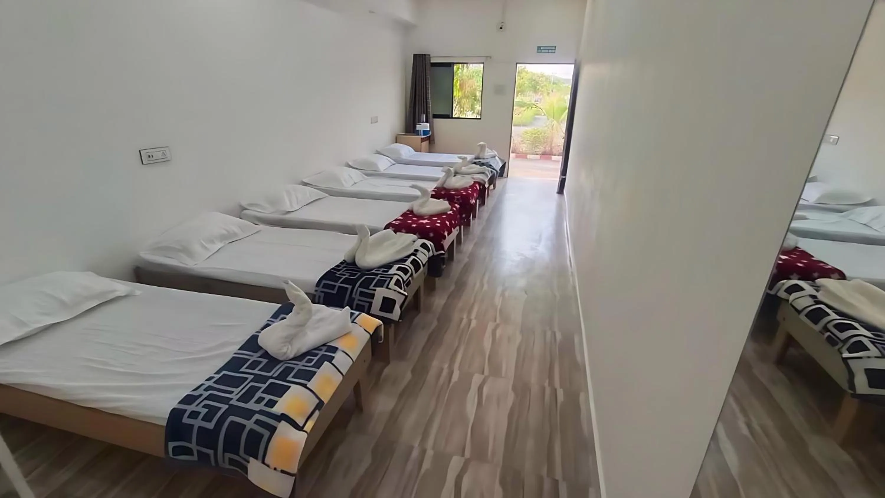 Photo of the whole room, Bed in AamraKunj Gir Resort