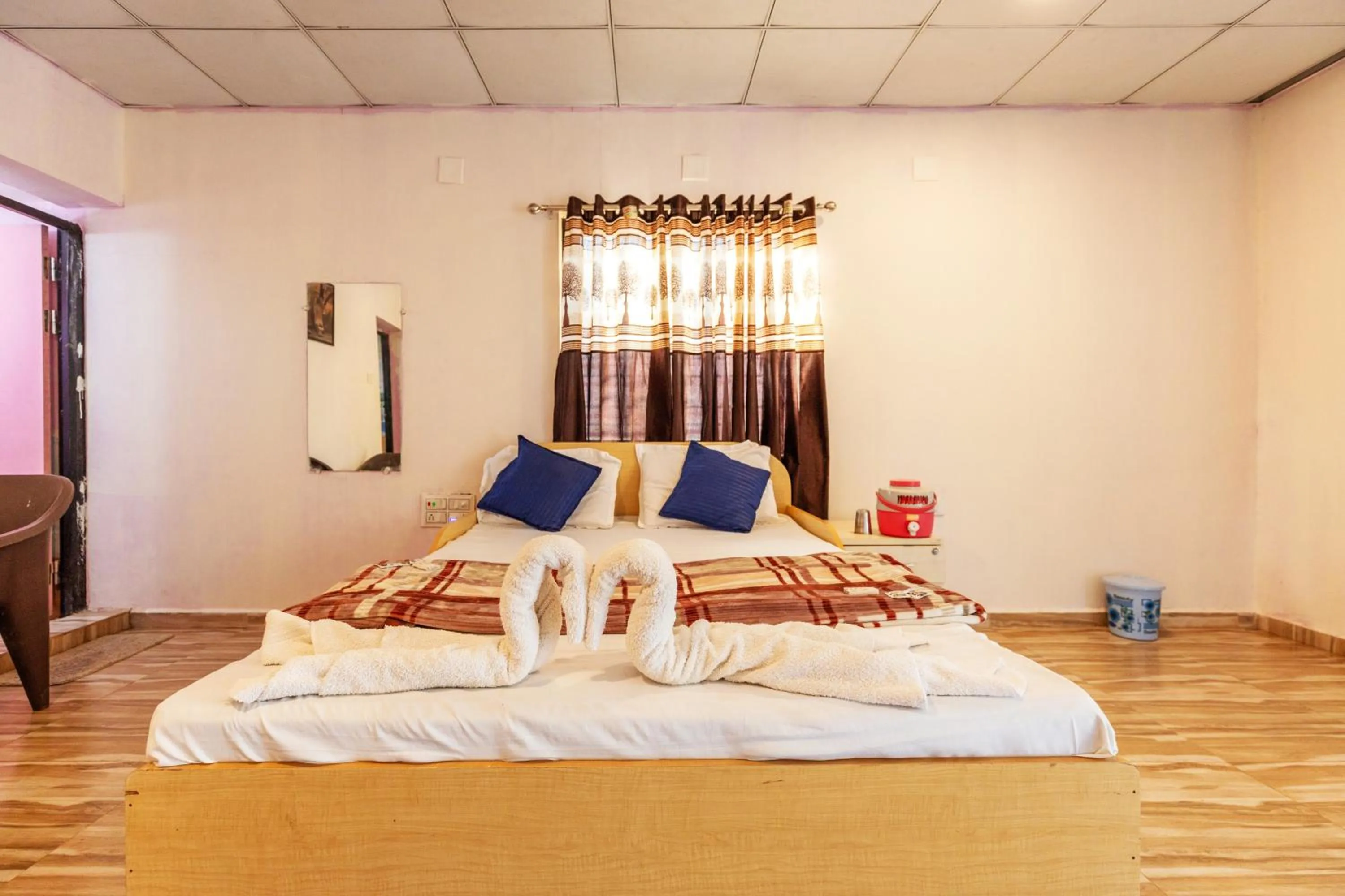 Bed in AamraKunj Gir Resort