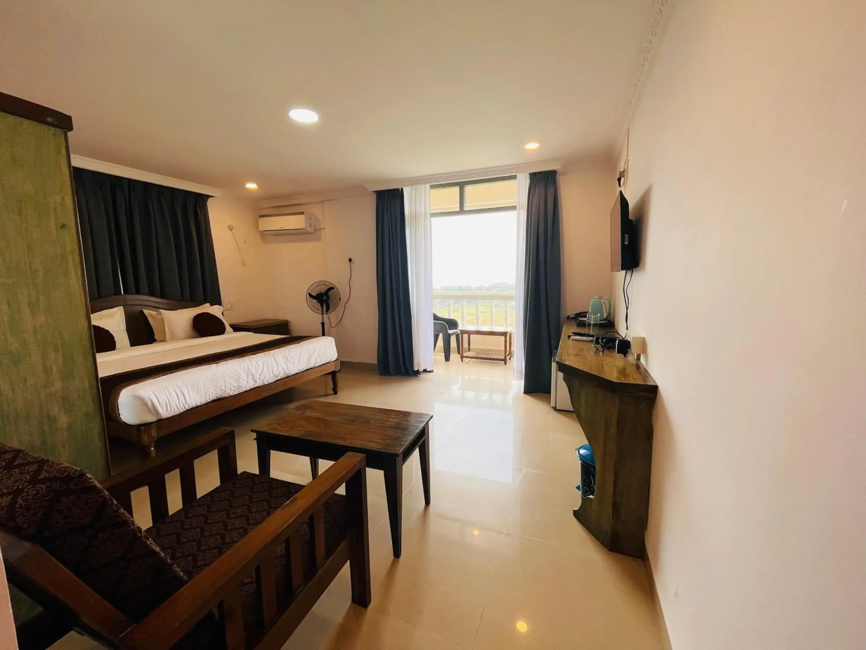 Living room, Bed in Nagas Hotel Satyavati Morjim Living room, Bed in Nagas Hotel Satyavati Morjim