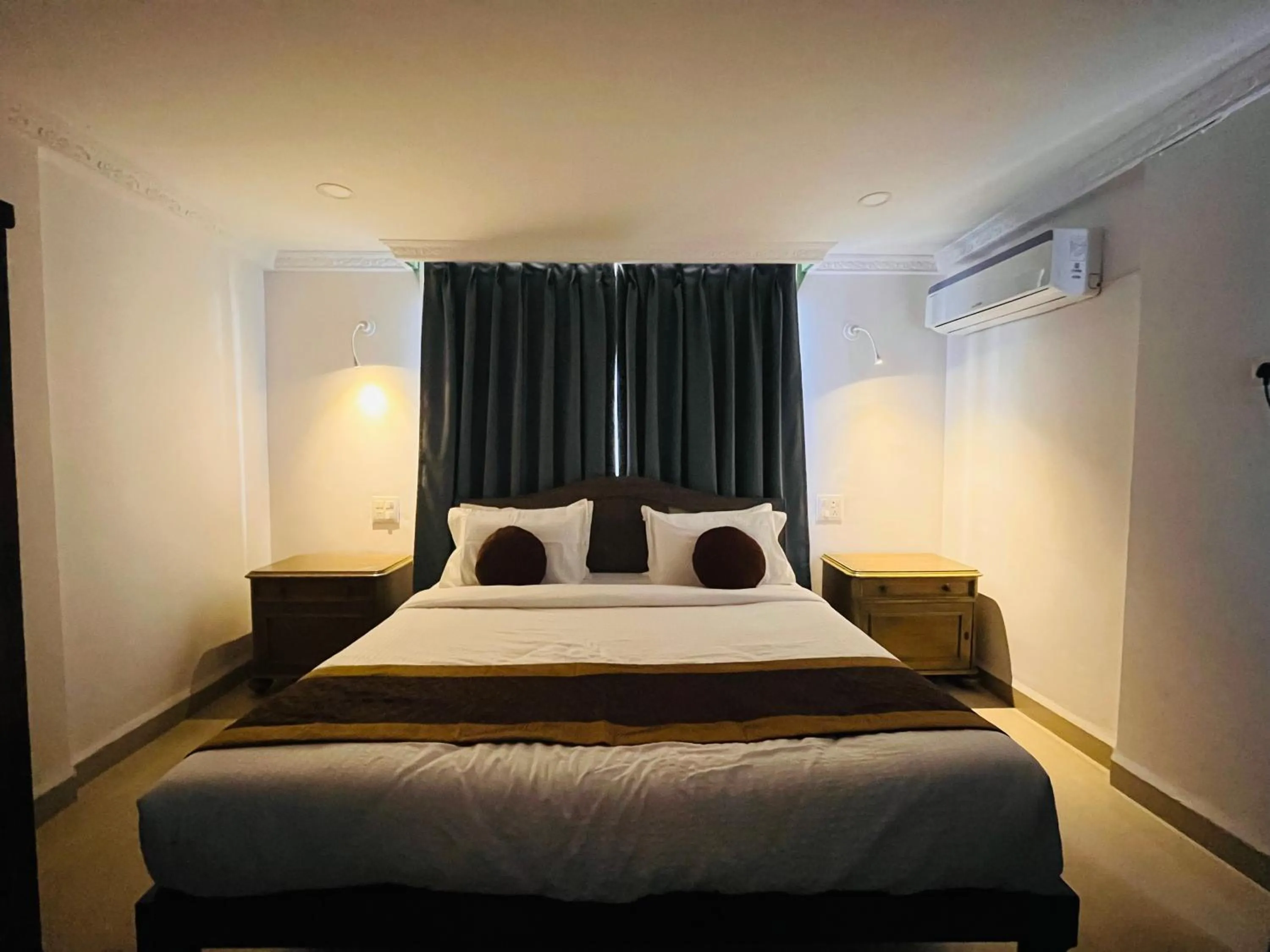 Bed in Nagas Hotel Satyavati Morjim