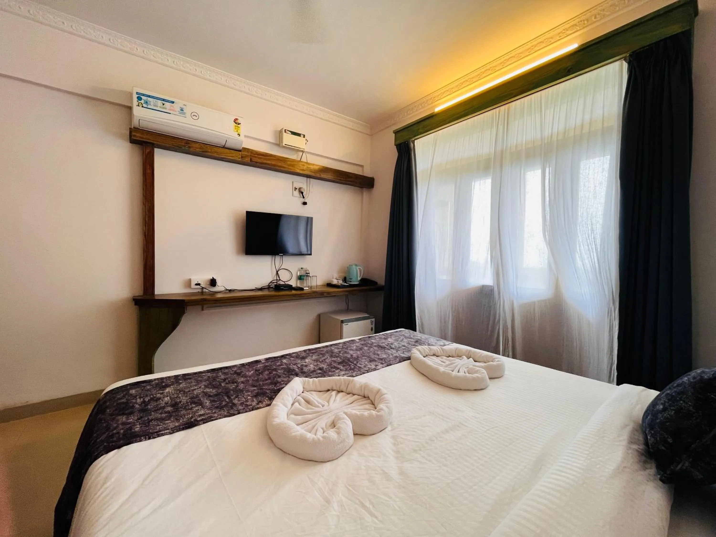 Bed in Nagas Hotel Satyavati Morjim