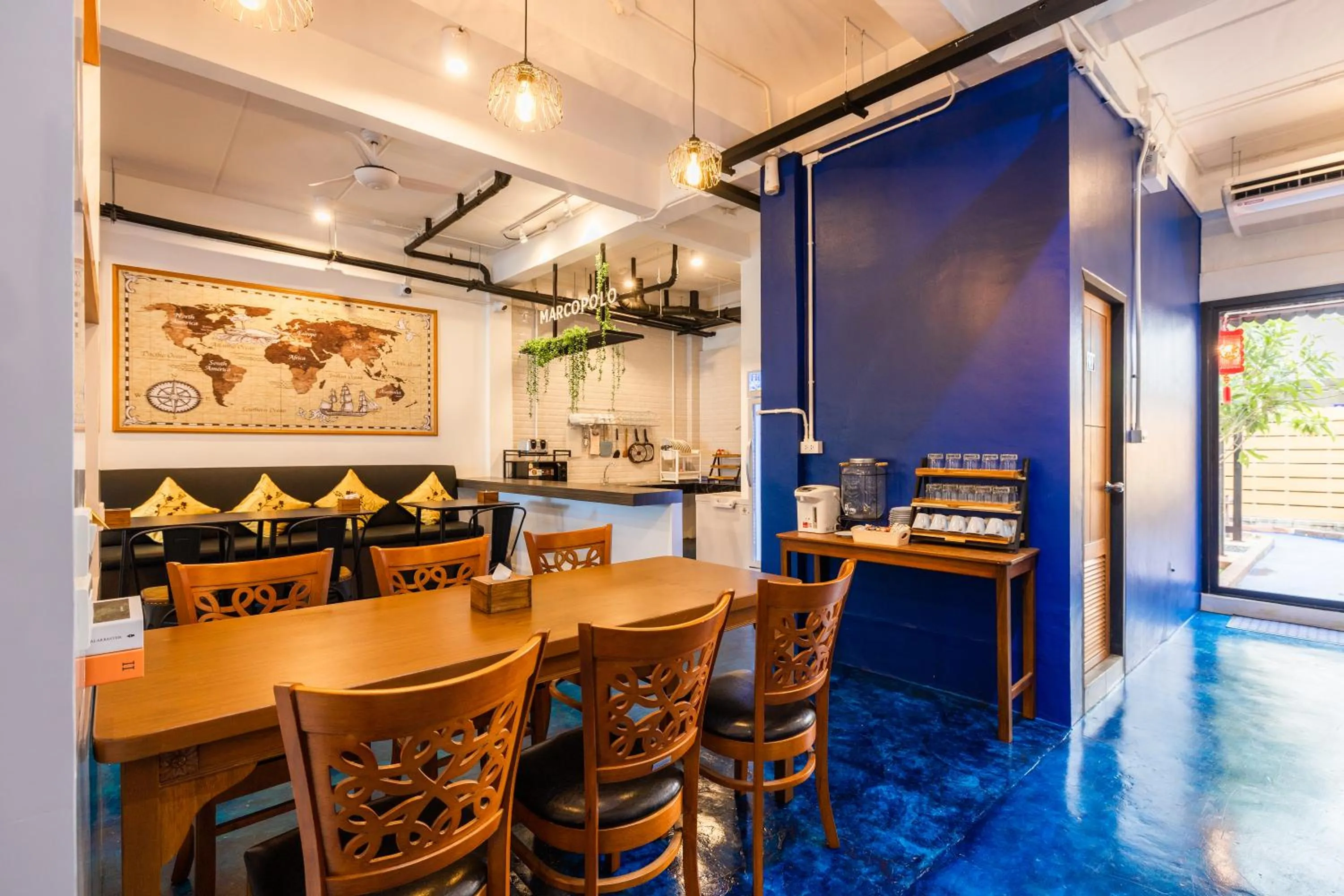 Communal lounge/ TV room in Marco Polo Phuket Poshtel & Bistro