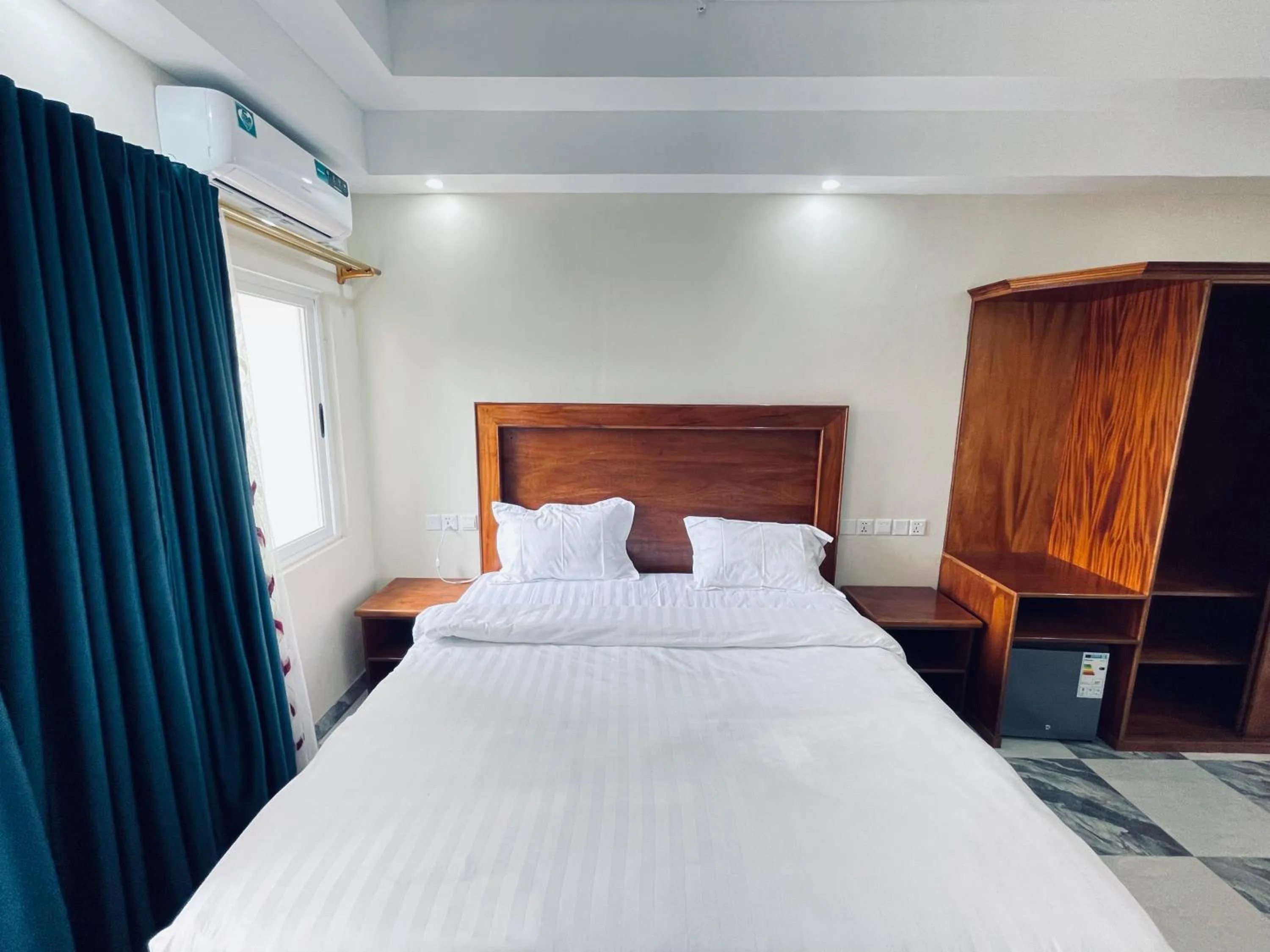 Bed in Pulickal Heights Hotel