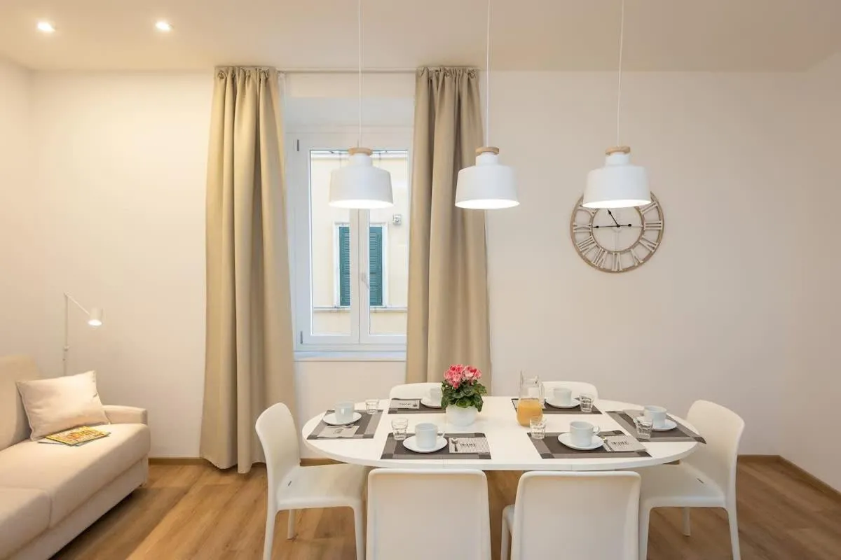 Living room, Bed in Colosseum Holidays - Three-Bedroom Apartment