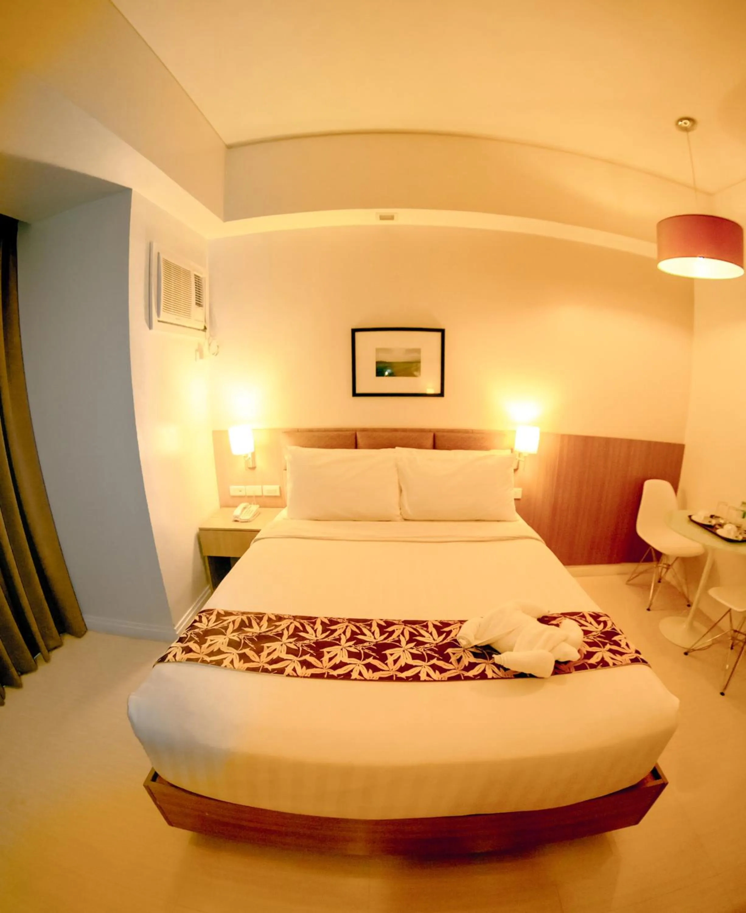 Bed in Zerenity Hotel & Suites