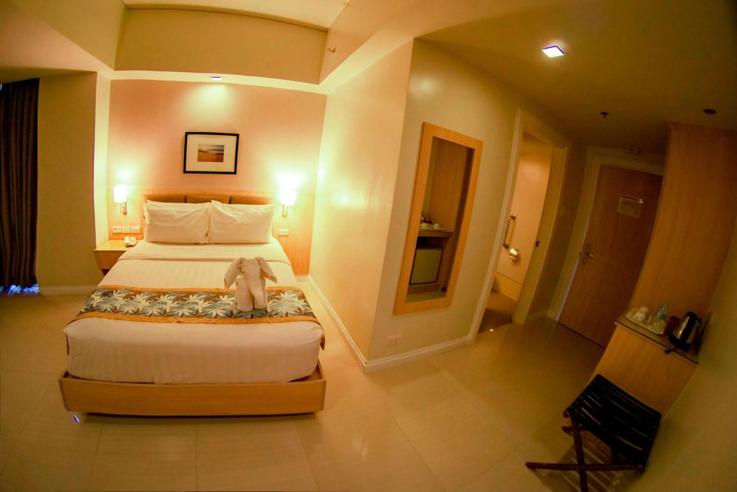 Bed in Zerenity Hotel & Suites