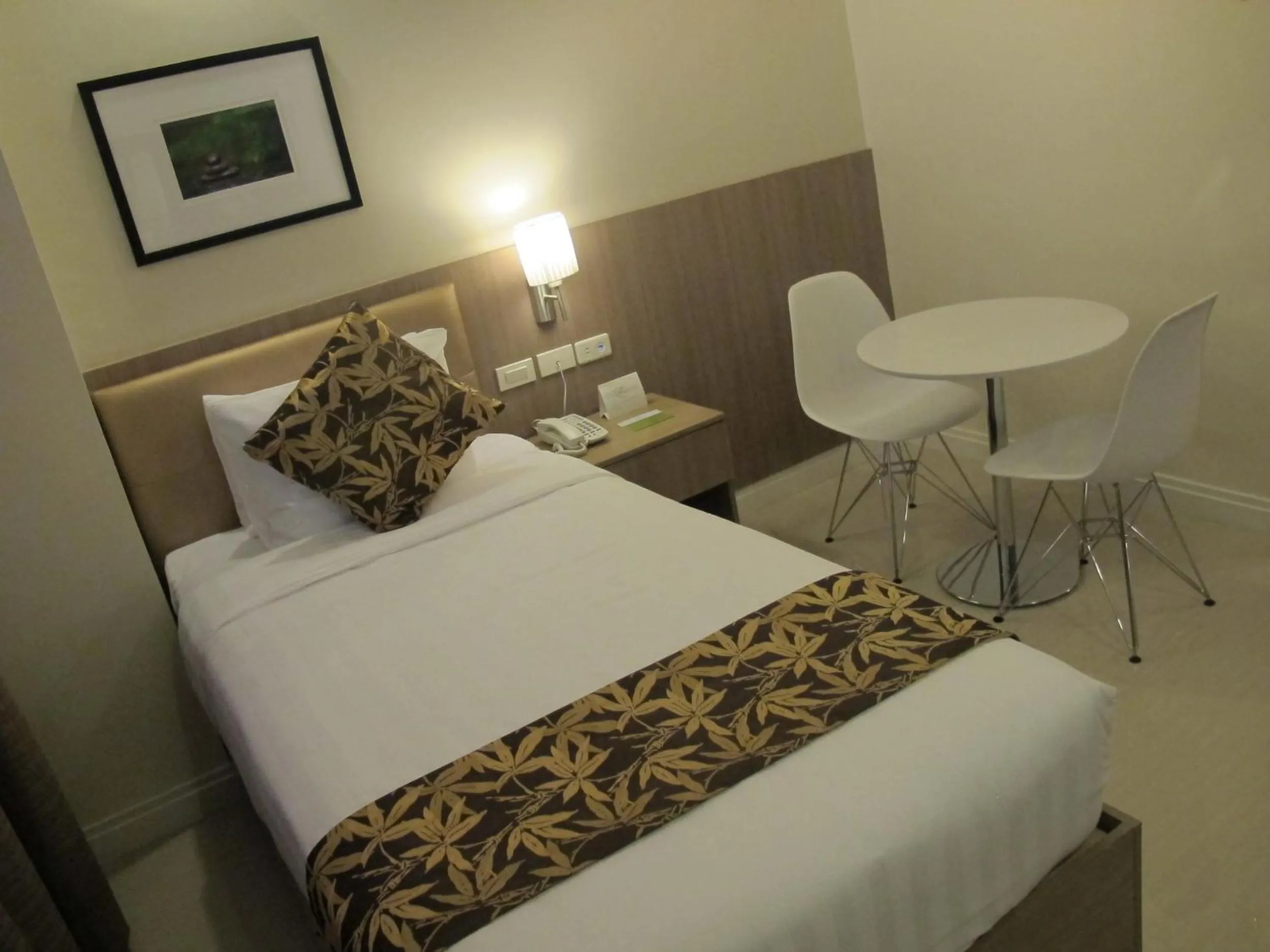 Photo of the whole room, Bed in Zerenity Hotel & Suites