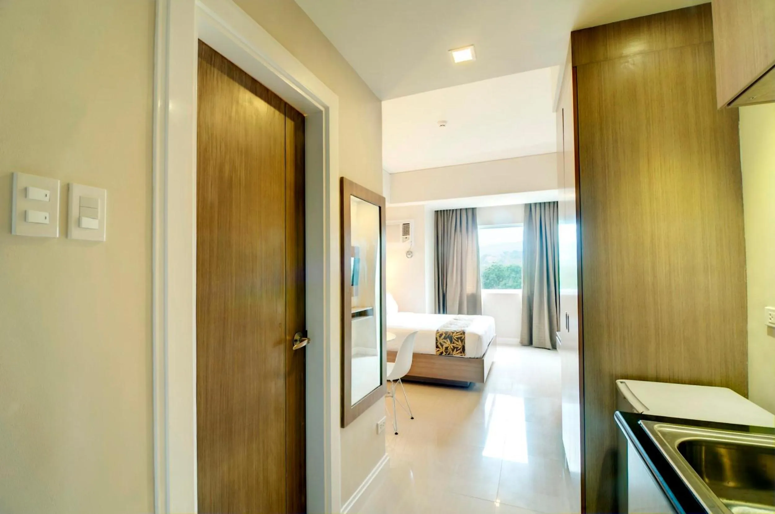 Photo of the whole room, Bed in Zerenity Hotel & Suites