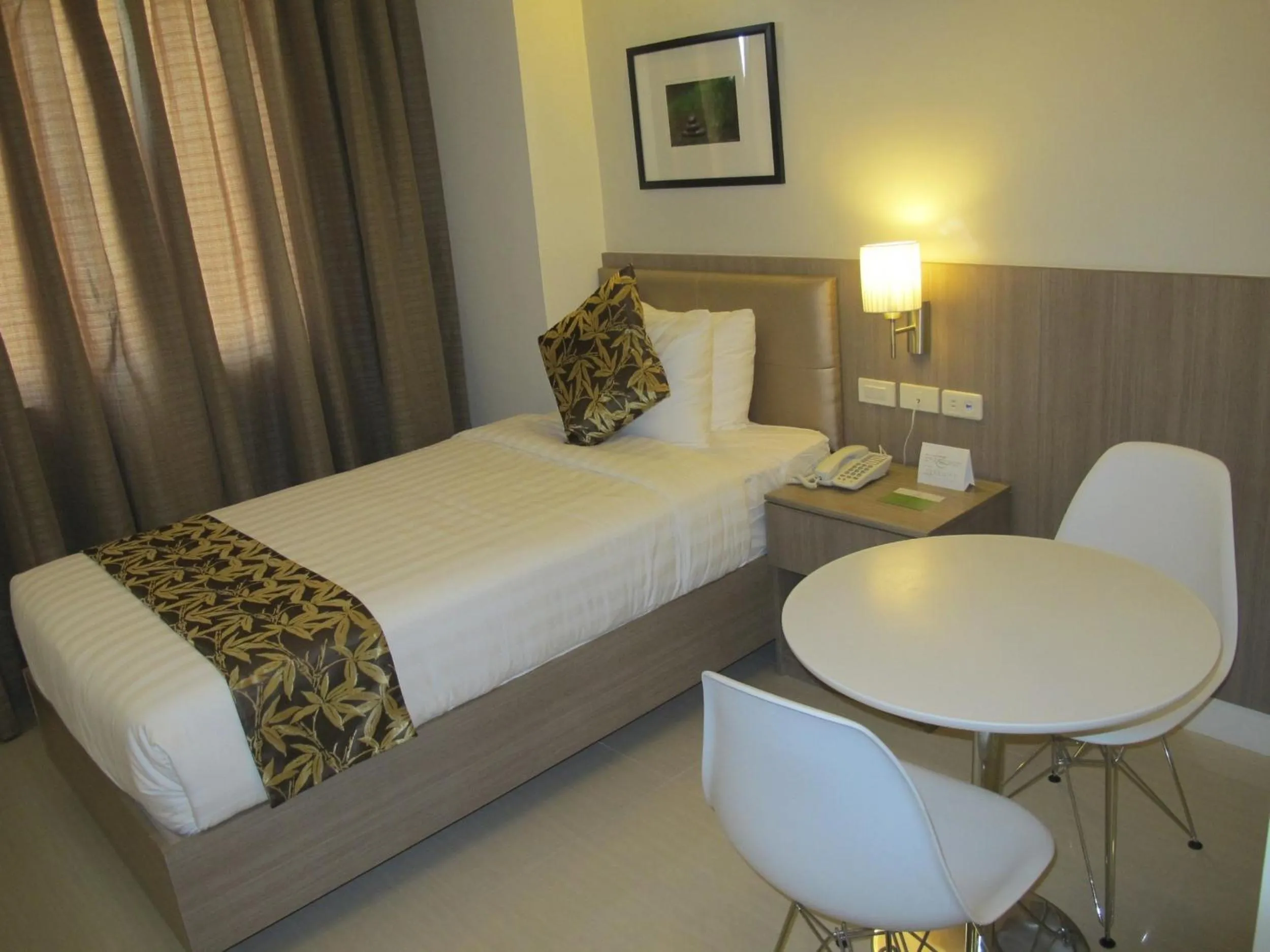 Photo of the whole room, Bed in Zerenity Hotel & Suites