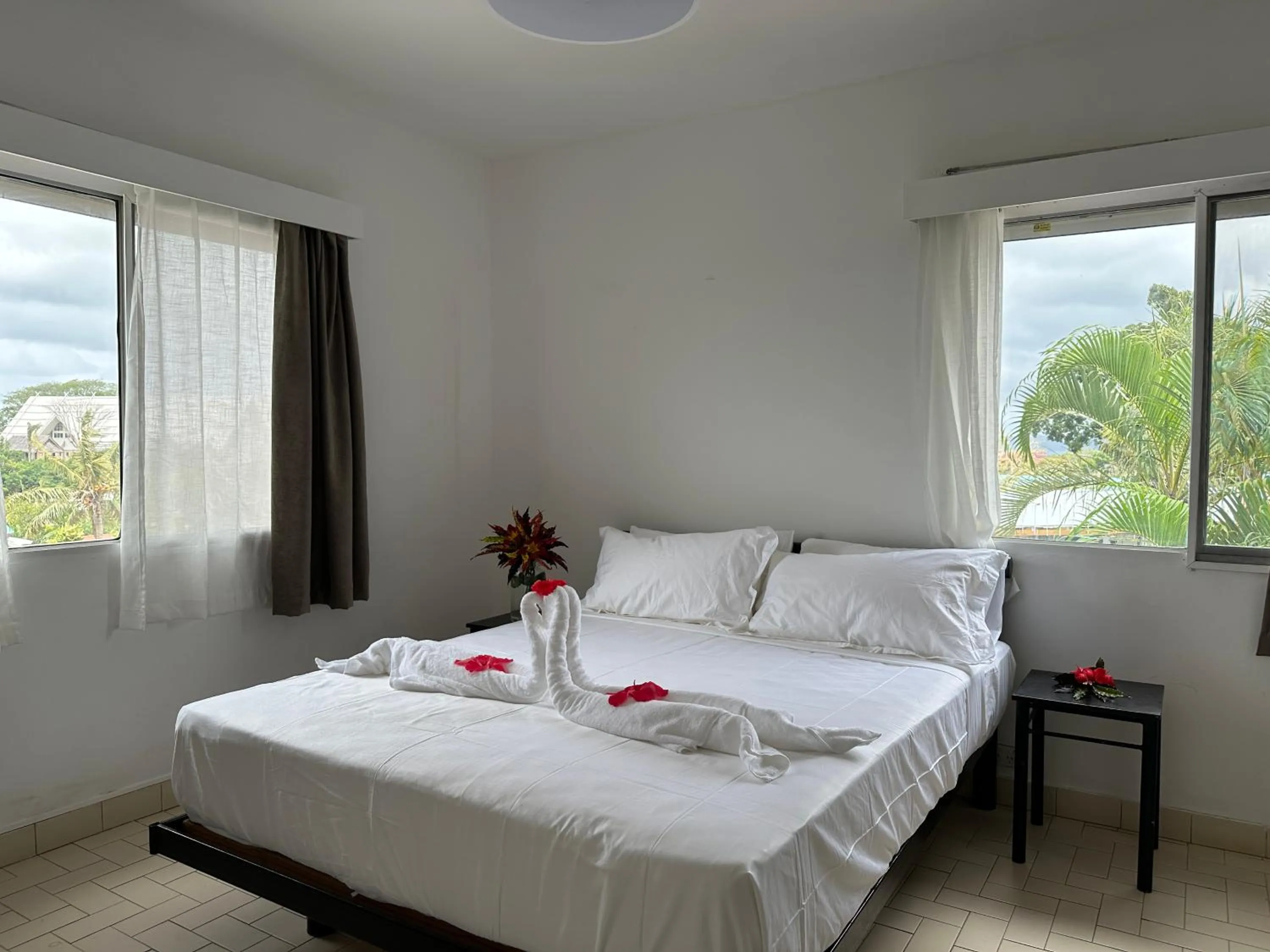 Bed in Coconut Palms Resort & Diamond Casino