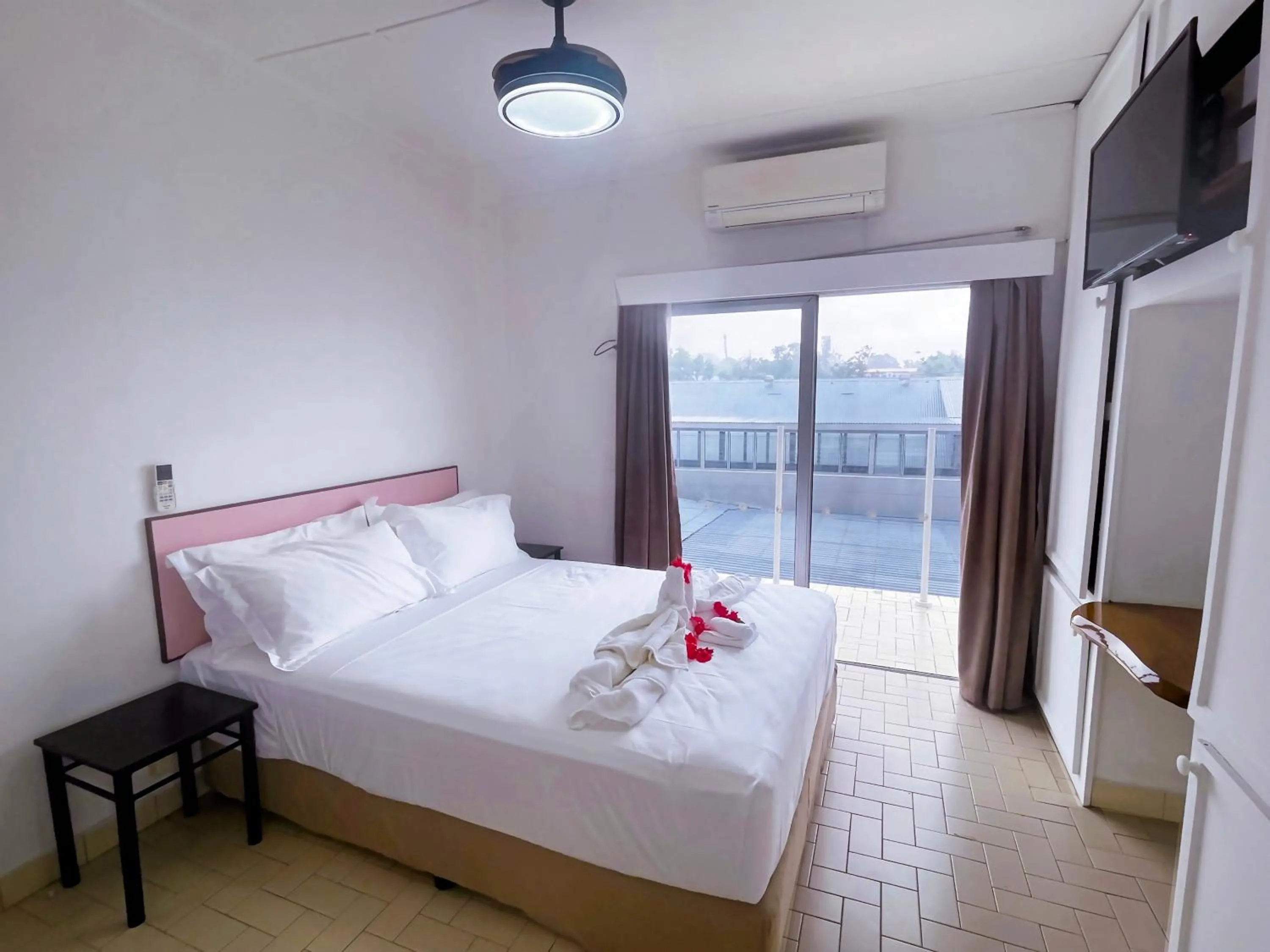 Bed in Coconut Palms Resort & Diamond Casino